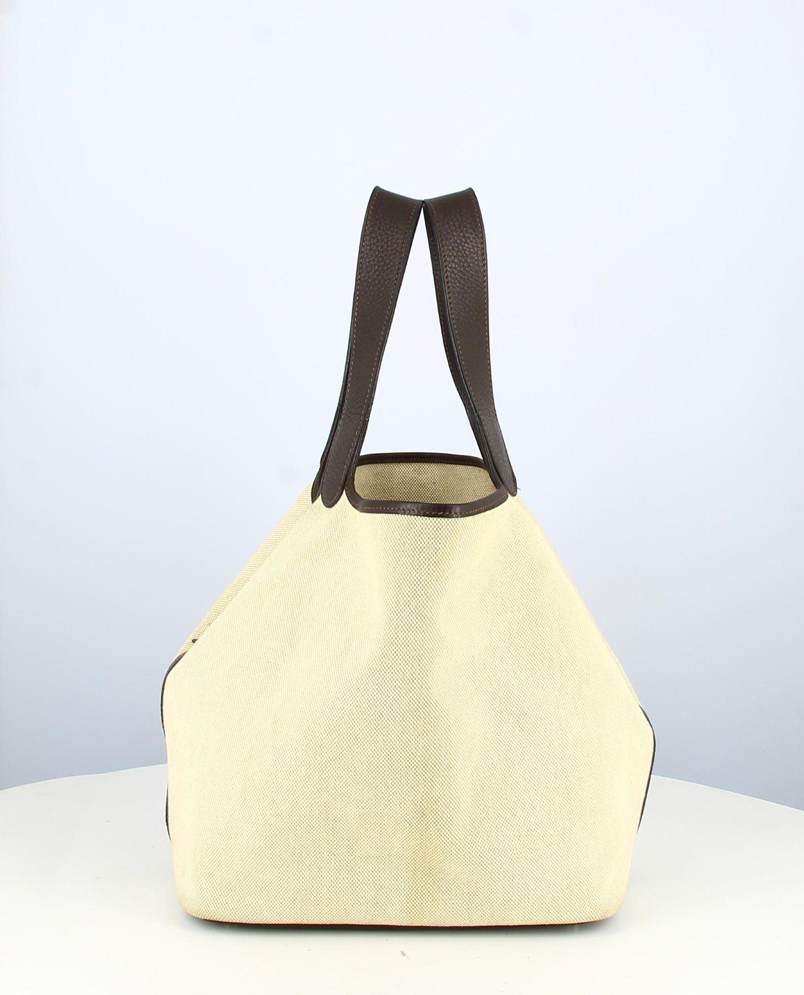 

Hermes Picotin GM Bag Beige Canvas
- Hermes Picotin bag, GM, in beige canvas, brown leather straps togo. Clasp, brown leather band togo
-Condition: - Good condition, small stains and signs of wear
- The interior is in beige canvas.
- Packaging :