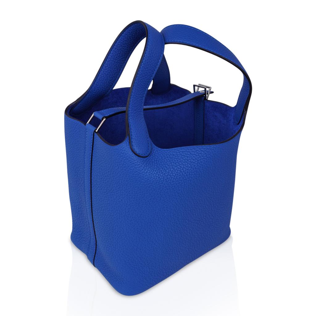 Guaranteed authentic Hermes Picotin Lock 18 tote bag featured in Blue Zellige.
A striking Blue, richly saturated and perfect for year round wear.
Clemence leather with Palladium hardware.
This roomy small tote is a perfect go to bag! 
Comes with