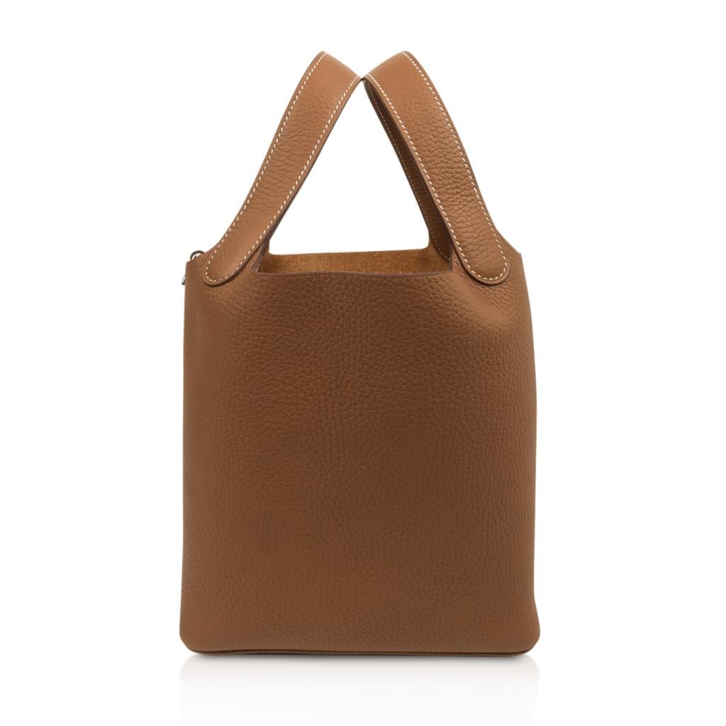 Guaranteed authentic Hermes Picotin Lock 18cm classic Gold bag.
Neutral tote in clemence leather.
This roomy little tote is the perfect go to bag!
Comes with lock and keys, sleeper, and signature Hermes box.
NEW or NEVER WORN
final sale

BAG