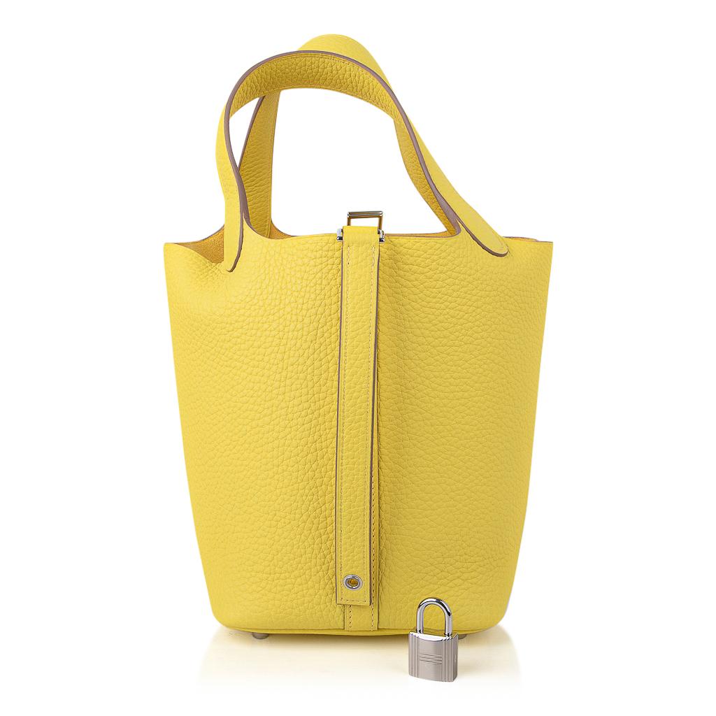 Guaranteed authentic Hermes Picotin Lock 18 tote bag featured in fresh vivid Lime.
Luscious clemence leather with Palladium hardware.
This roomy small tote is a perfect go to bag! 
Comes with lock and keys, sleeper, and signature Hermes box.
NEW or