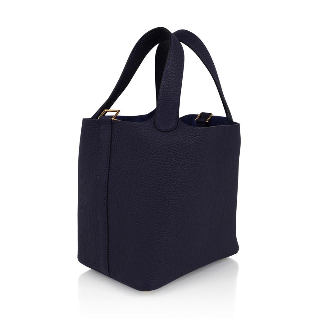 Mightychic offers an Hermes Picotin Lock 18 tote bag featured in richly saturated Blue Nuit.
Beautifully accentuated with Gold hardware.
This roomy little tote is the perfect go to bag!
Comes with lock and keys, sleeper, and signature Hermes