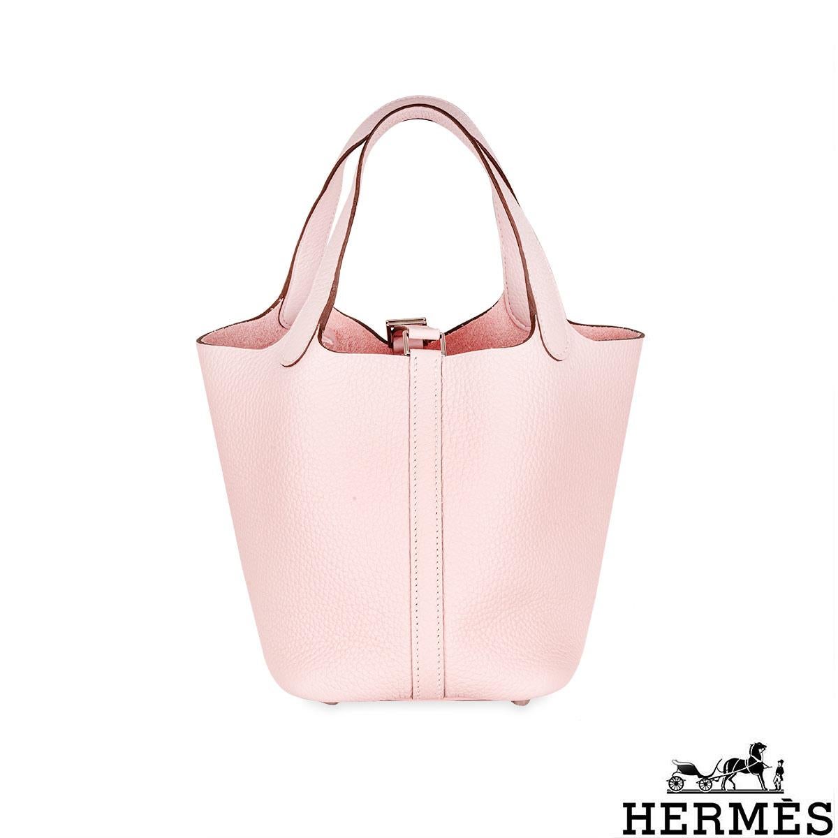 A Chic Hermès Picotin Lock 18 bag. A design inspired by horse troughs, the Picotin is a classic and timeless Hermès bags. The exterior of this Picotin features Taurillon Clemence leather in Rose Sakura. The interior features a natural rawhide lining