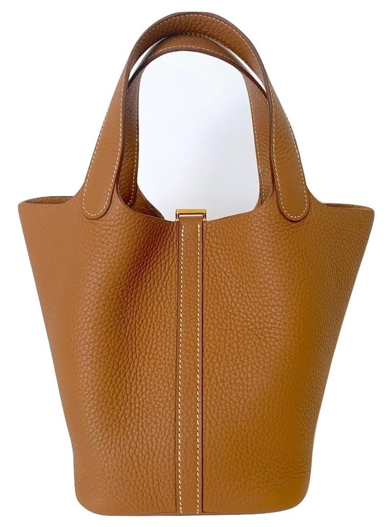 Hermes Picotin Lock
18cm Size
This is the small one, the most wanted size 18cm
Gold Clemence with Gold Hardware
Timeless
Its lining-less, clean-cut leather and plain, flexible handles make it the ultimate bag
Bag in taurillon Clemence leather with
