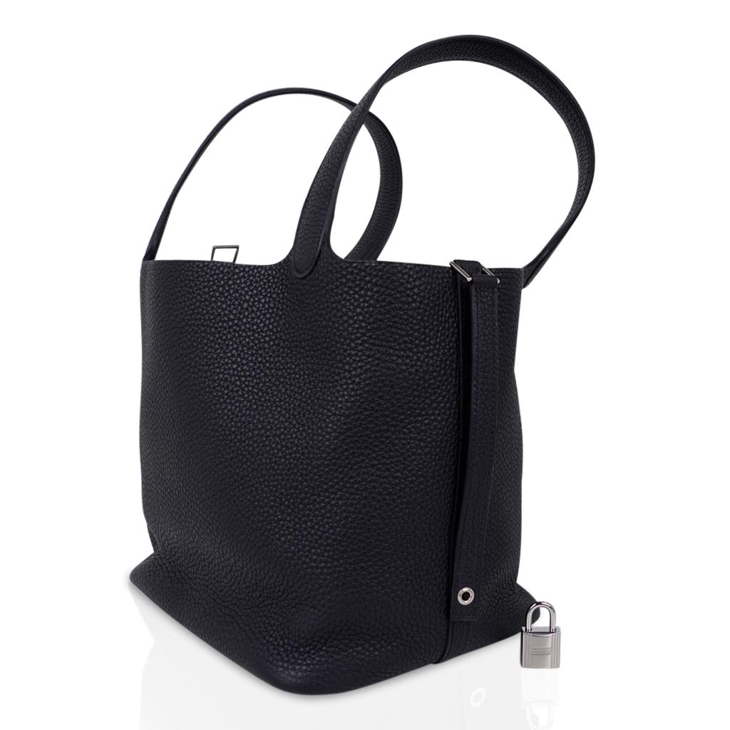 Guaranteed authentic Hermes Picotin Lock 22 bag featured in Black Clemence leather.
Fresh with palladium hardware.
This roomy tote is a perfect go to bag!
Comes with Signature Hermes box, lock, keys and sleeper.
NEW or NEVER WORN
final sale

BAG