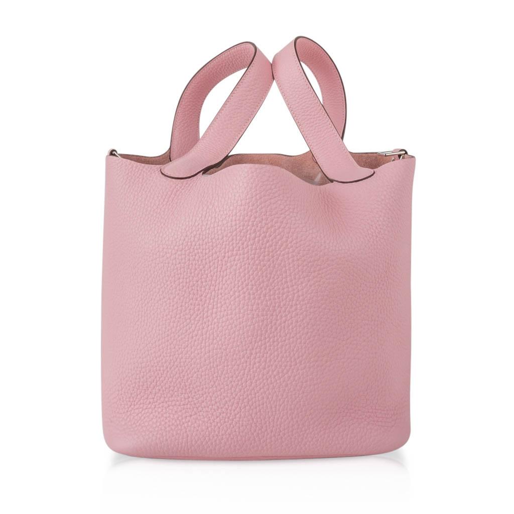 Guaranteed authentic Hermes Picotin Lock 22cm Rose Sakura in Clemence.
Fresh with palladium hardware.
This roomy small tote is a perfect go to bag! 
Comes with lock, keys and sleeper.
final sale

BAG MEASURES:
LENGTH  22cm / 8.5