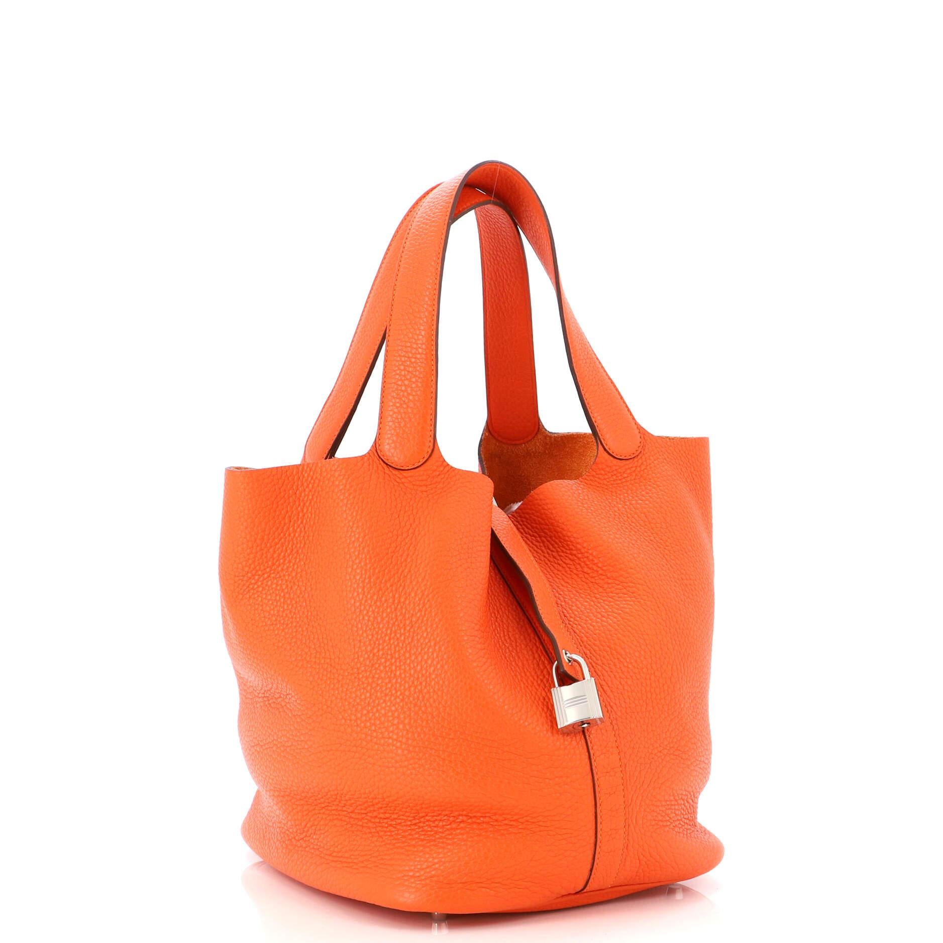 Condition: Very good. Creasing and wear on exterior, handles and in interior, splitting on handle wax edges, loss of shape on closure trim. Small marks in interior, scratches on hardware.
Accessories: Keys, Lock
Measurements: Handle Drop 9