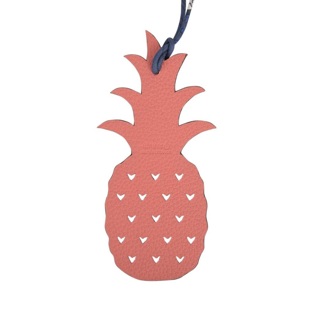 Guaranteed authentic coveted Hermes Petit h Bi-Color Pineapple calfskin bag charm with silk twill cord.
This whimsical charm comes in Pink and Green and can be worn as a bag charm or key holder.
Charming and playful she easily adorns a myriad bag