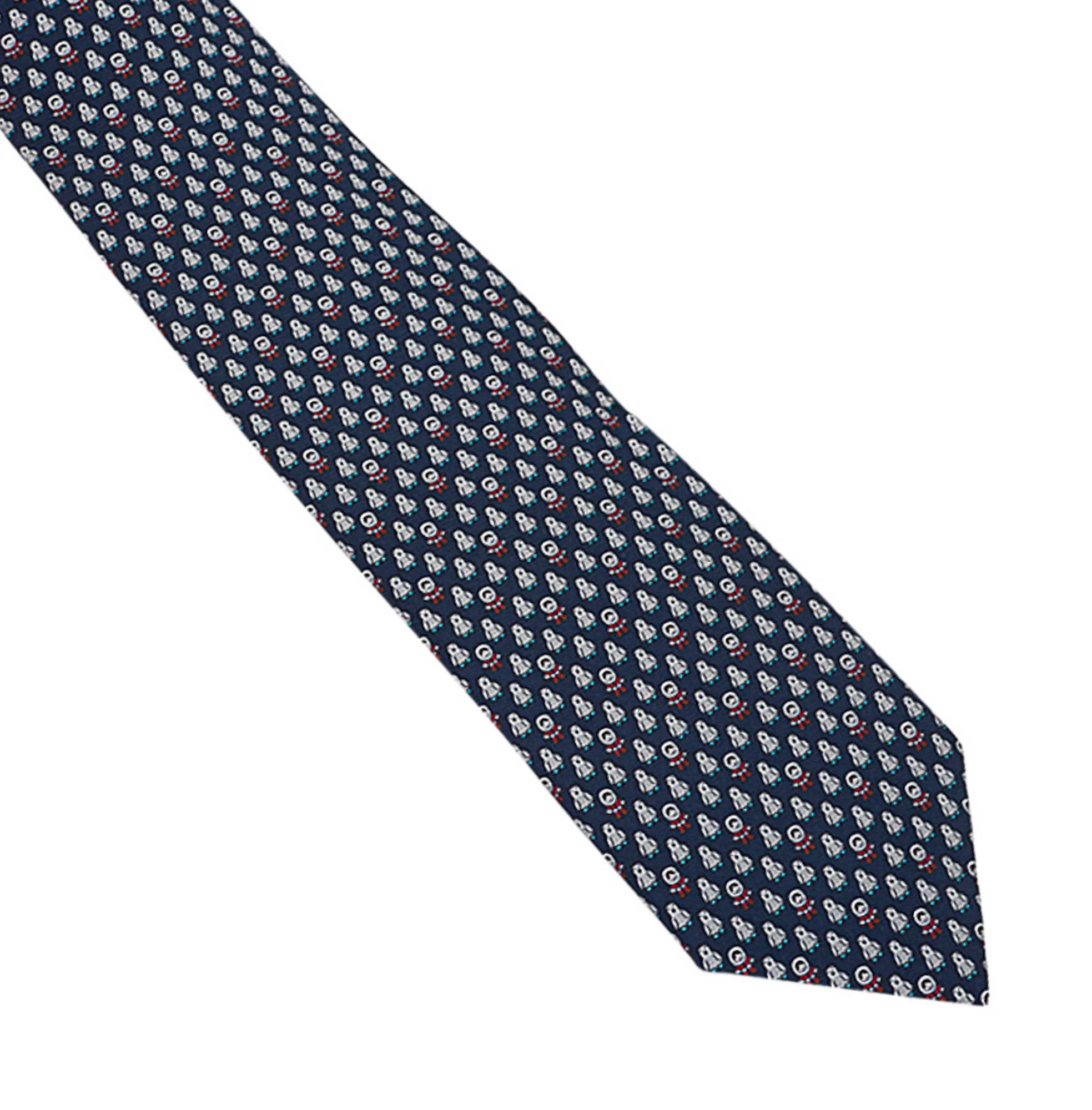 Mightychic offers an Hermes Pingloo Twillbi silk tie featured in Marine and Rouge.
Charming Inuit and Penguins adorn the front.
The inner has small foot steps along the length.
The interior hides an igloo!
This delightful piece is a perfect addition