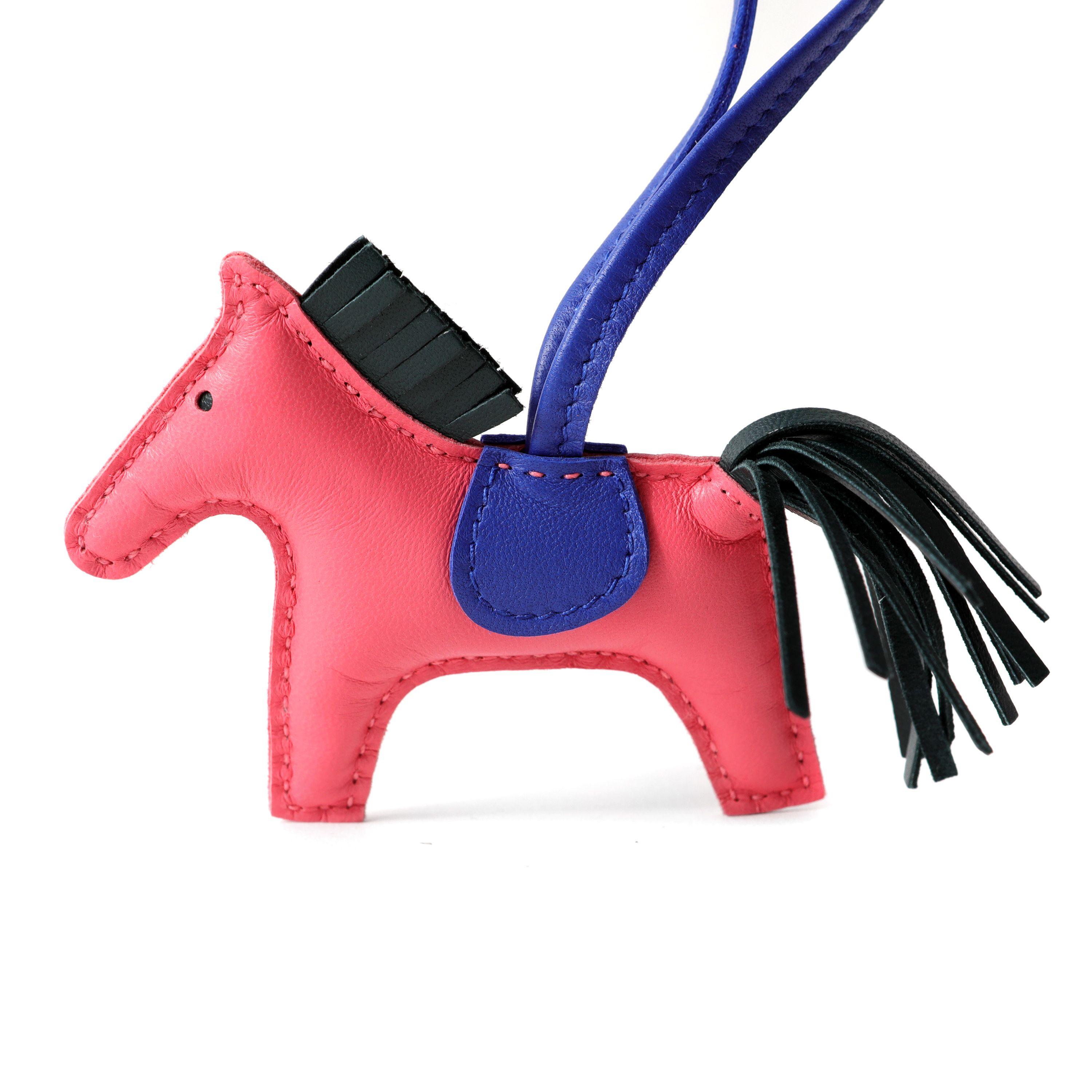 This authentic Hermès Pink and Blue Leather Rodeo Charm is pristine.  Box included.

PBF 13978
