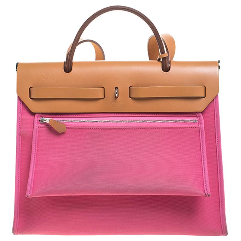 Made from pink canvas and leather, the Herbag Zip is just as outstanding as all of Hermes' other handbags. First introduced in 2009 as a new version of the Herbag, this piece comes with a single handle, a long shoulder strap and it flaunts fabulous