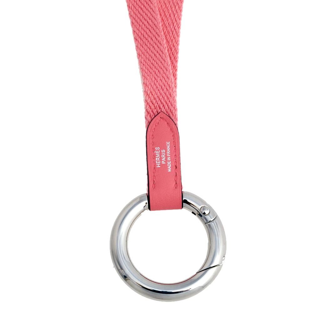 Keep your keys handy with this Hermès lanyard. Made from pink canvas and leather, its signature print and metal ring give it a classy appeal. Keep your keys easy to access with this lanyard.

Includes: Original Box
