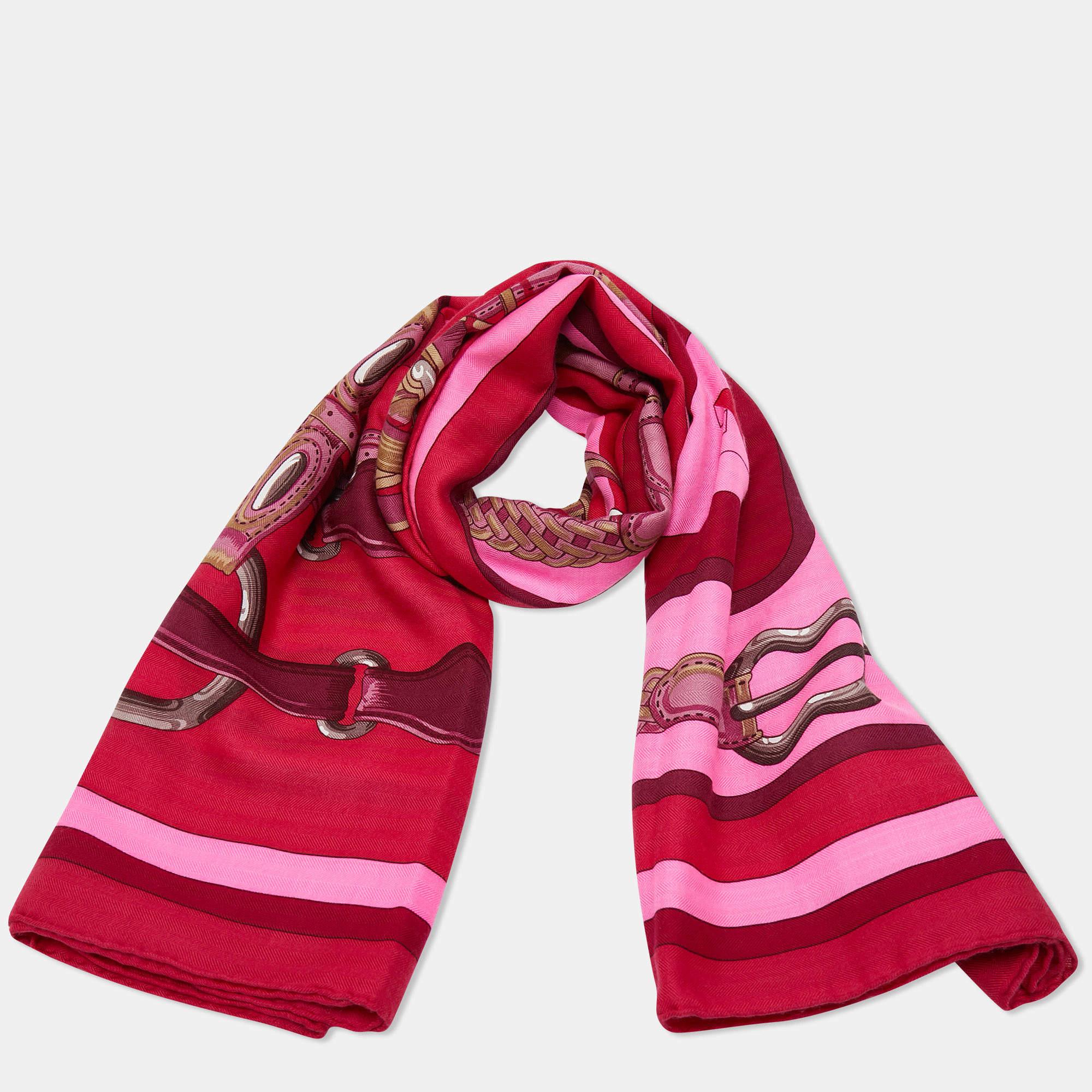 The Hermès shawl is a luxurious and exquisite accessory. Made from a blend of high-quality cashmere and silk, it features a pink color with a unique coaching design. The shawl is generously sized, allowing for various styling options, and provides a