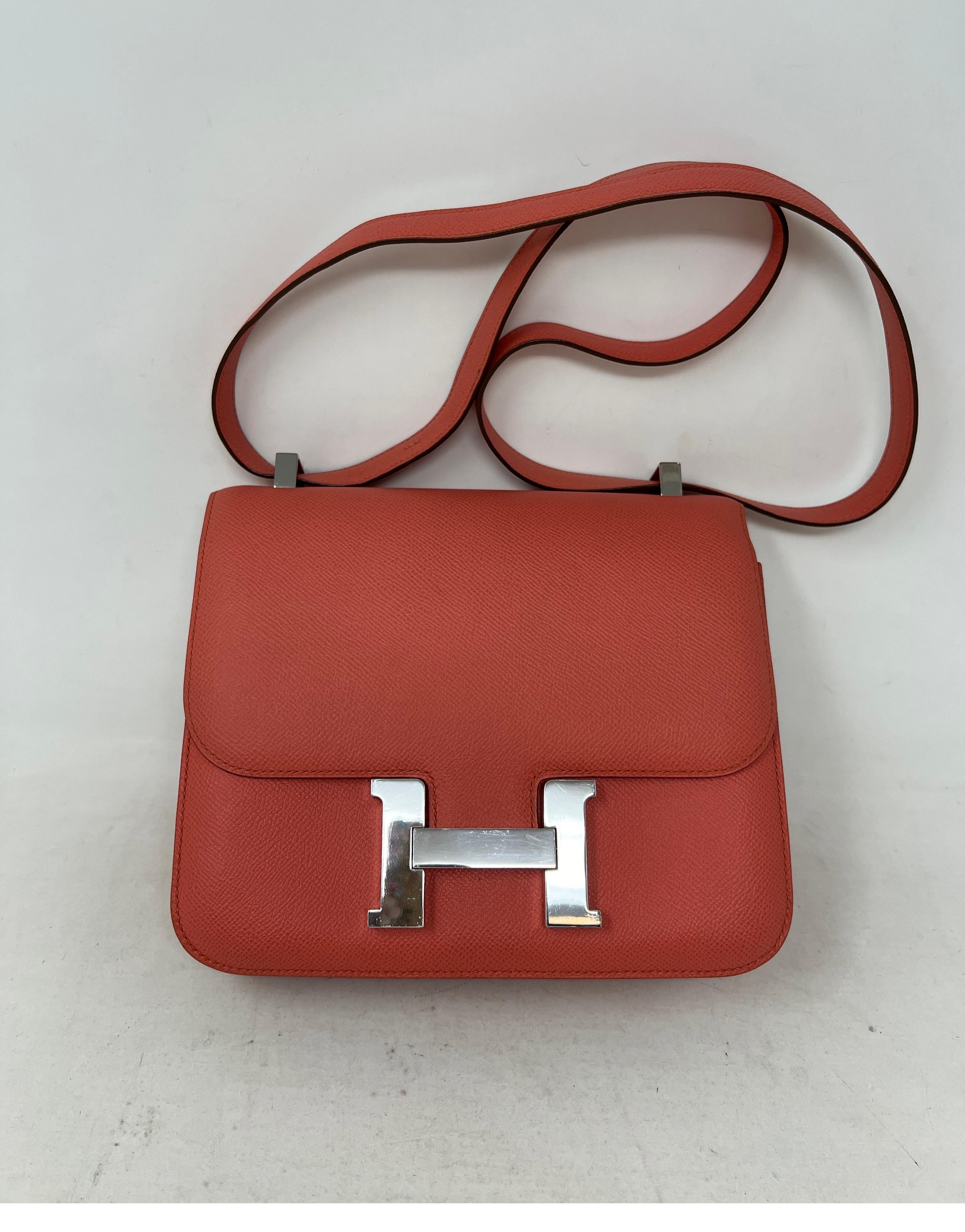 Hermes Pink Constance 24 Bag. Swift leather in great condition. Palladium silver hardware. Salmon pink color. Can be worn as a longer bag or shorter. Inside clean. Includes dust bag and box. Guaranteed authentic. 