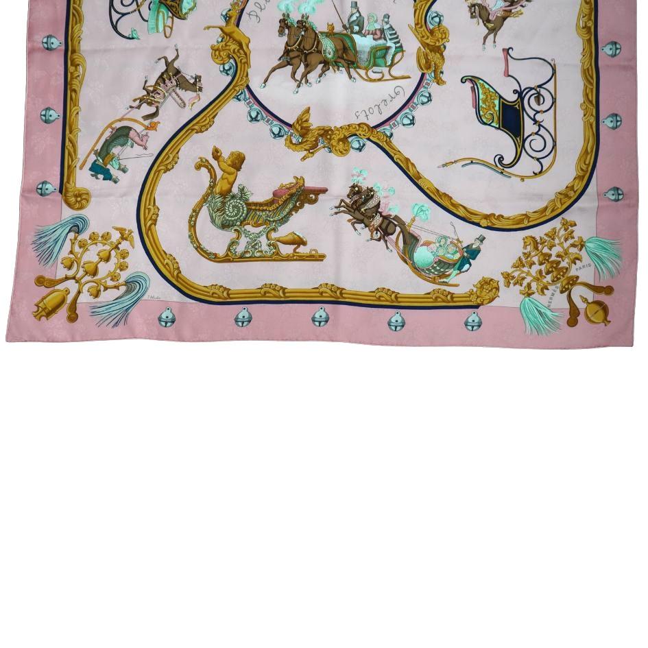 Hermès Pink 'Plumes et Grelots' Silk Scarf by J. Abadie
This scarf is winter festive and features horse drawn carriages 
Perfect condition