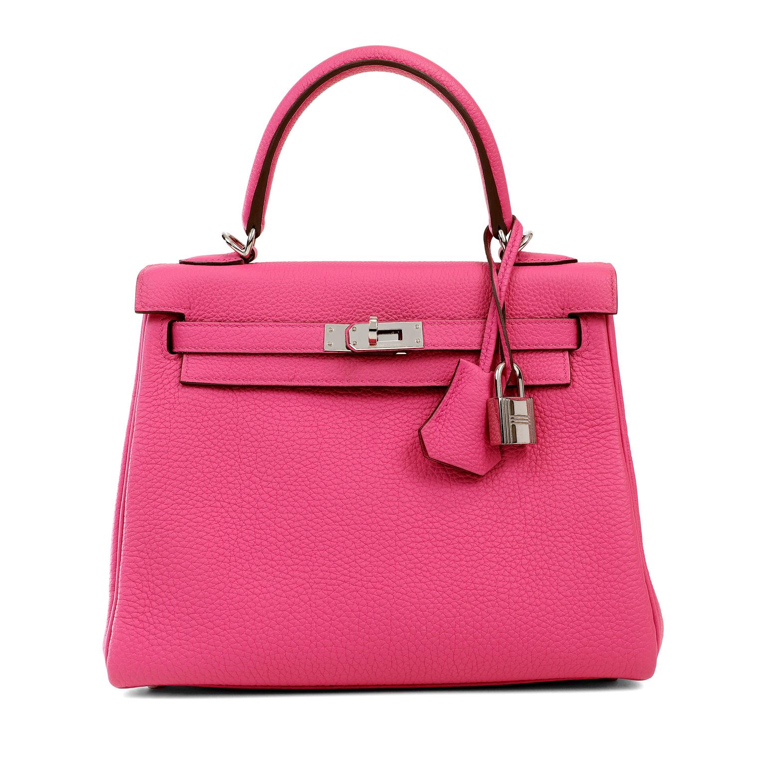 This authentic Hermès Pink Magnolia Togo 25 cm Kelly is in pristine condition.   Hermès bags are considered the ultimate luxury item worldwide.  Each piece is handcrafted with waitlists that can exceed a year or more.  The ladylike Kelly is classic