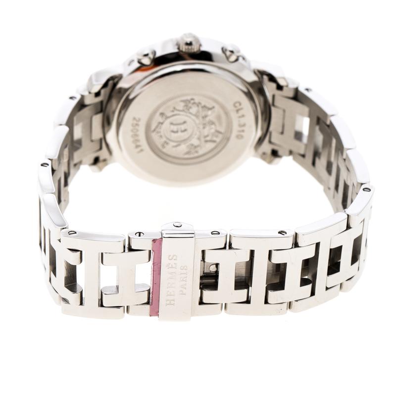 Designed with a modern aesthetic, this Clipper wristwatch from Hermes is sophisticated and slick. Made from stainless steel, the bezel is styled with studs. It features a pink Mother of Pearl dial fitted with Arabic numeral hour markers, three