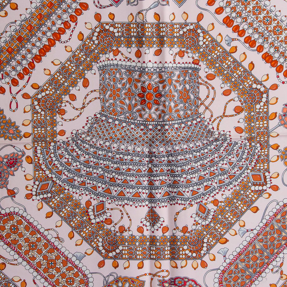 100% authentic Hermes 'Parures des Maharajas 90' scarf by Catherine Baschet in Rose Pale (pale pink) silk twill (100%) with contrasting orange hem and details in coral, salmon pink, cognac, beige, red and white. Has been worn and is in excellent
