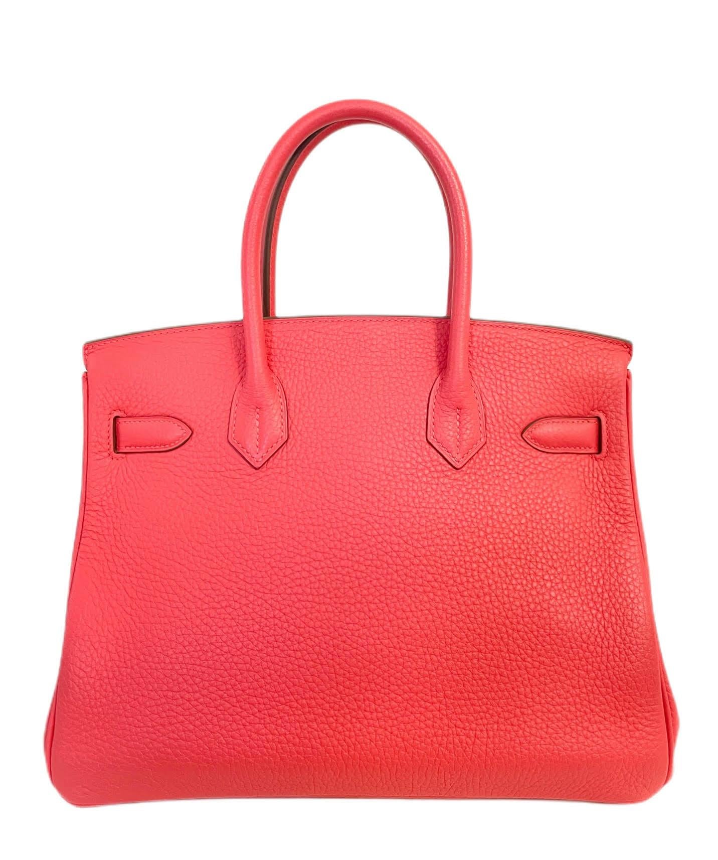 This authentic Hermès Pink Rose Clemence 30 cm Birkin is in pristine condition with the protective plastic intact on the hardware.  Hermès bags are considered the ultimate luxury item the world over.  Hand stitched by skilled craftsmen, wait lists