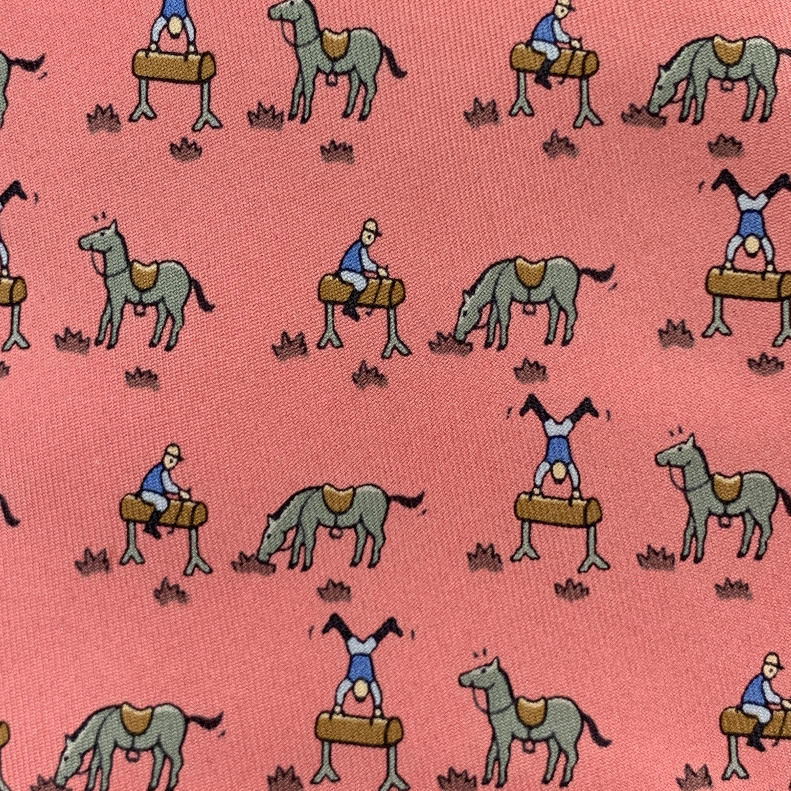 HERMES necktie comes in pink silk twill with all over horse jockey print. Minor wear. As-is. Made in France.

Very Good Pre-Owned Condition.

Width: 3.75 in.