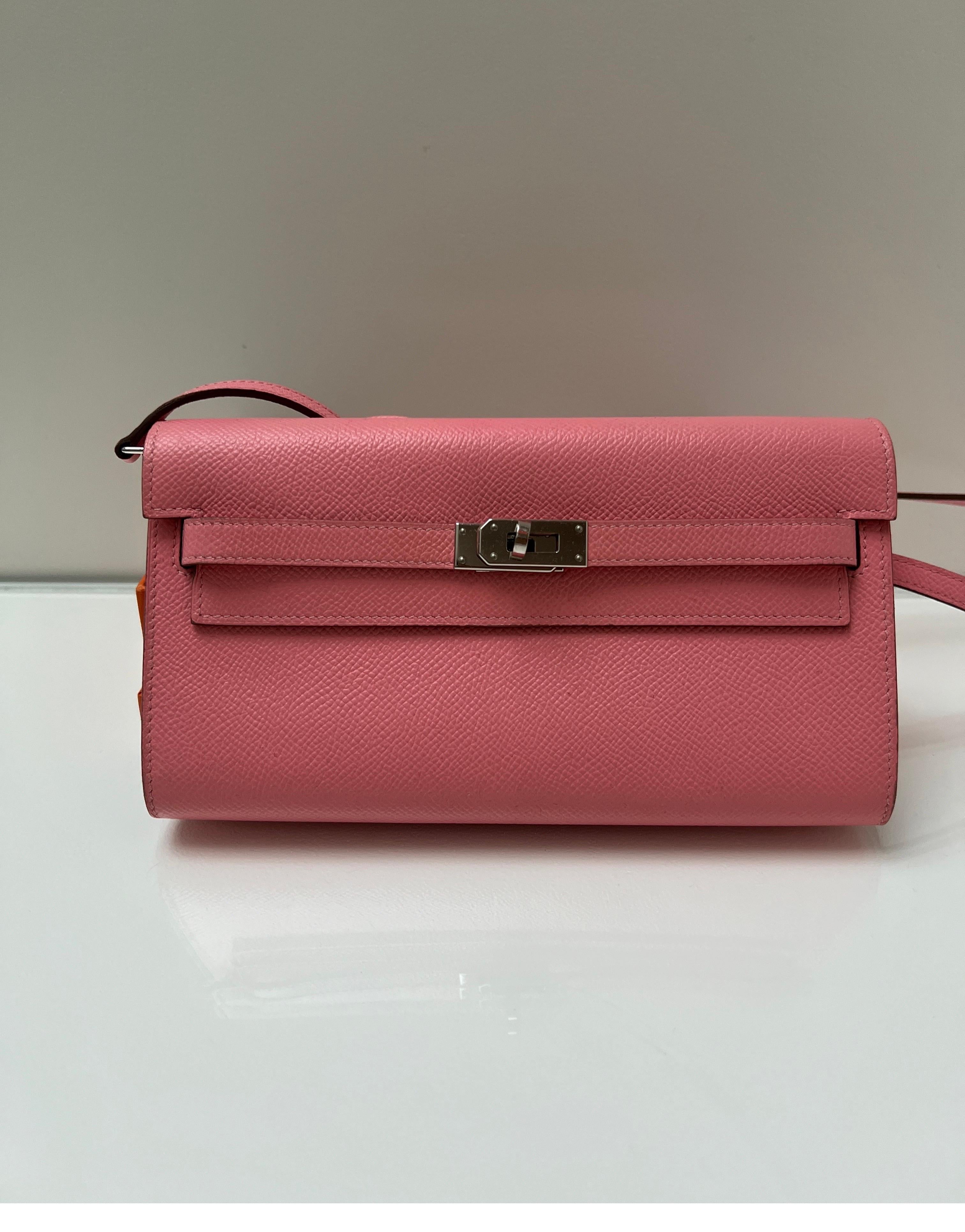 Hermes Pink Togo Wallet Crossbody Bag. Light pink color epsom leather bag. Can be worn as a clutch or as a crossbody bag. Beautiful color and in excellent like new condition. Hard to get and in this color. Palladium silver hardware. Comes full set