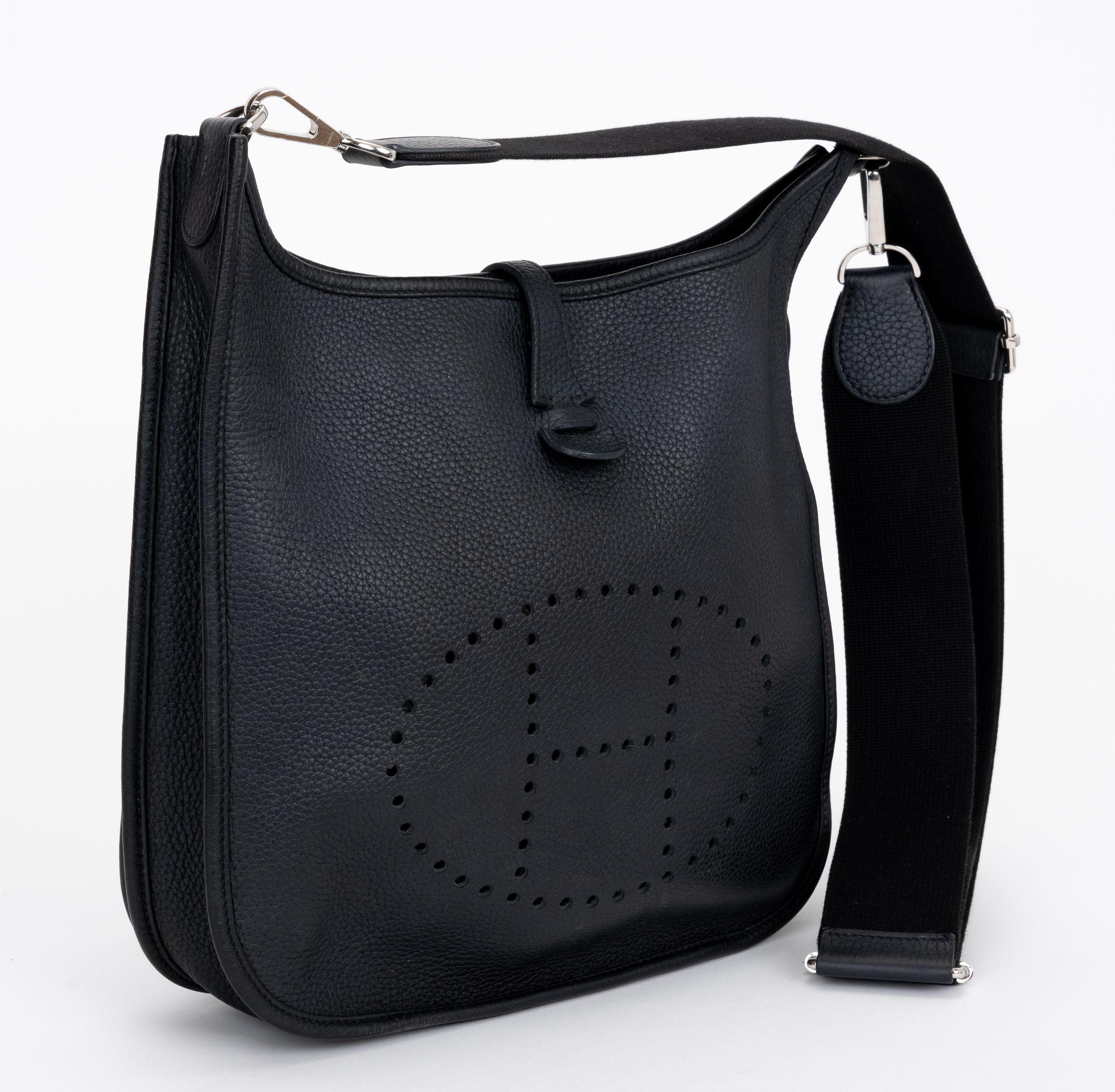 The Hermes Evelyne PM bag in black with Palladium hardware. The bag can be worn as a shoulder or cross body bag. Date stamp Z. Excellent condition, minor wear inside. Comes with original dust cover.
