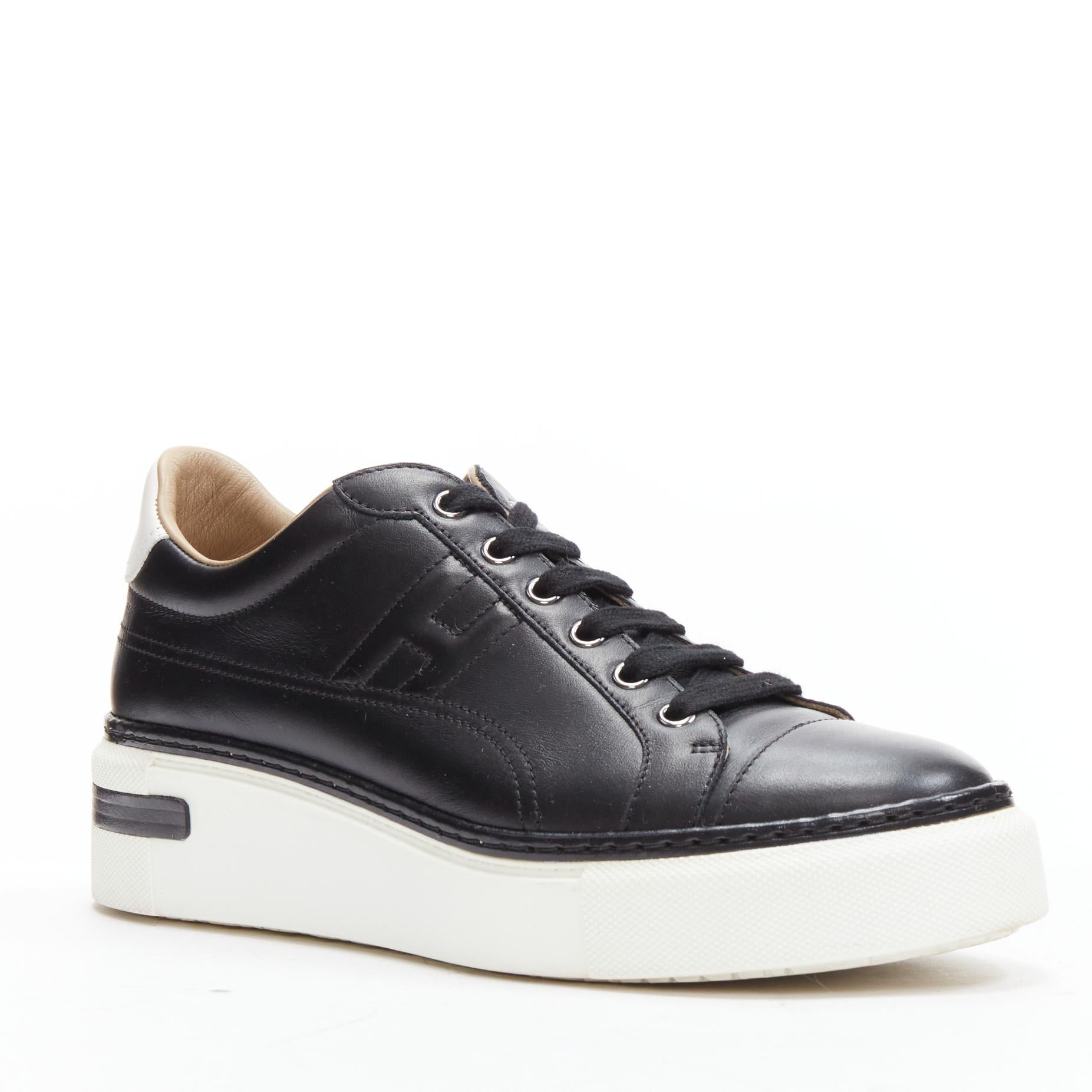 HERMES Polo black leather H padded logo white platform sneakers EU39
Reference: JYLM/A00047
Brand: Hermes
Model: Polo
Material: Leather
Color: Black
Pattern: Solid
Closure: Lace Up
Lining: Nude Leather
Extra Details: hite embossed logos at back of