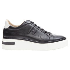 HERMES Polo in pelle nera H. H. imbottita con logo bianco, scarpe da ginnastica con plateau EU39