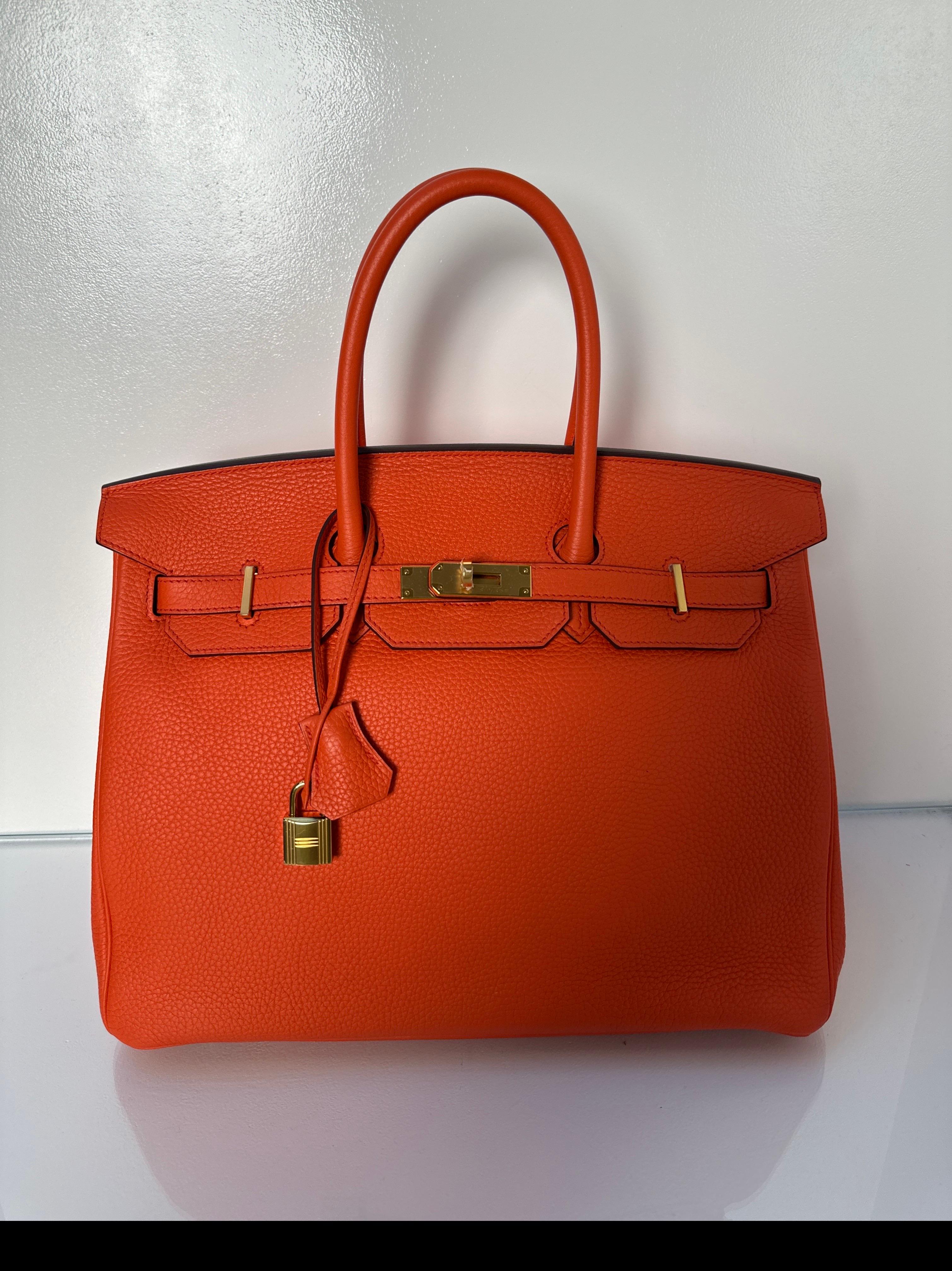 Hermes Poppy Orange Birkin 35 Bag. Excellent like new condition. Gold hardware. Interior clean. Togo leather. Gift worthy. Includes clochette, lock, keys, and dust bag. Guaranteed authentic. Priced to sell. Won't last.