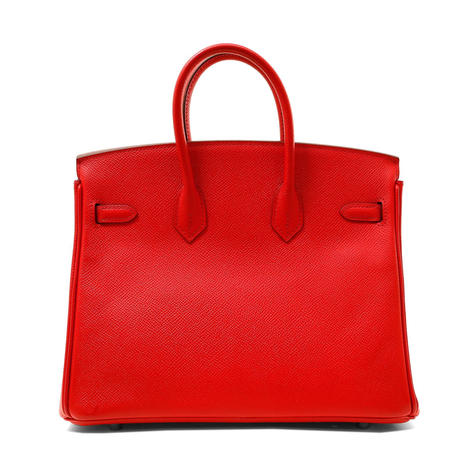This authentic Hermès Poppy Red Epsom Leather 25 cm Birkin is in pristine condition.  A sensational shade of head turning lipstick red, it is perfectly paired with bright Palladium hardware.  
Epsom leather is textured and lightweight, known for