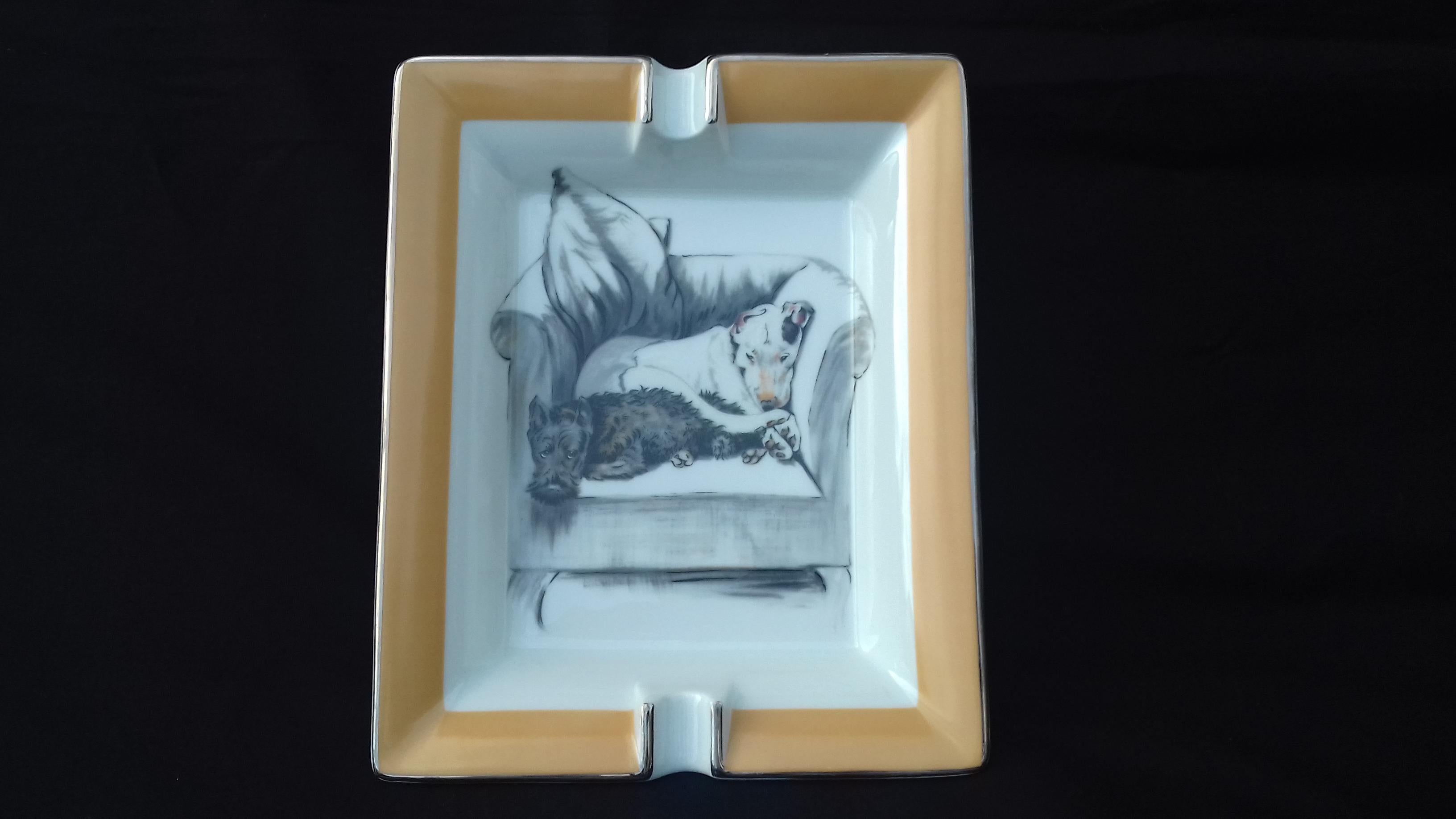 Rare Authentic Hermès Ashtray

Pattern: 2 dogs napping on an armchair

Made in France

Made of Printed Porcelain and Silver-Tone edges

Colorways: White Background, Beige Border, Black Grey and White drawings

