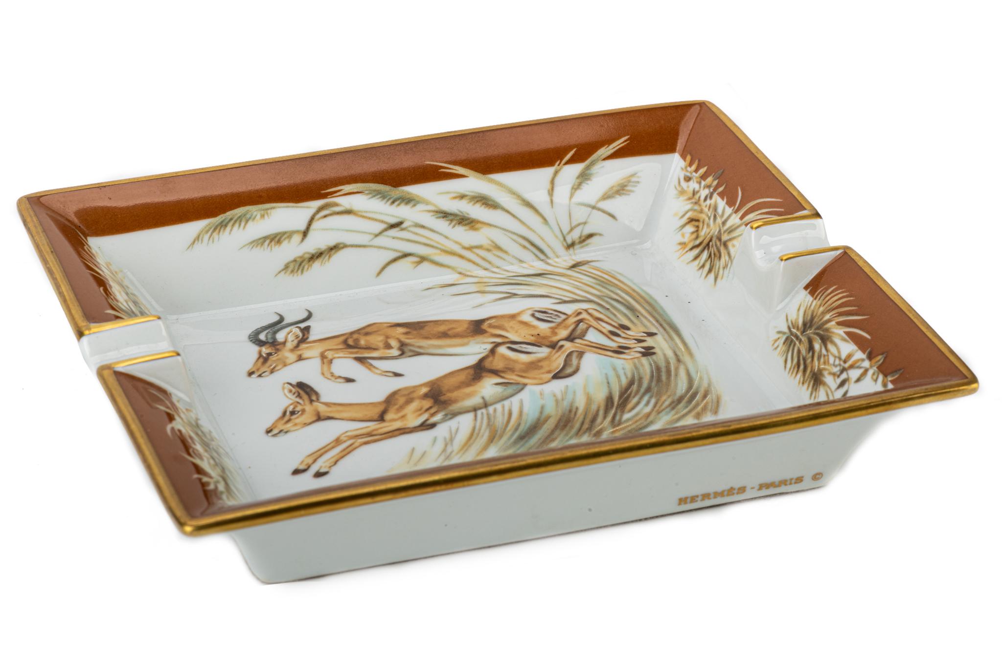 Vintage Hermes ashtray showing a pattern with two jumping antelopes in center of the piece.