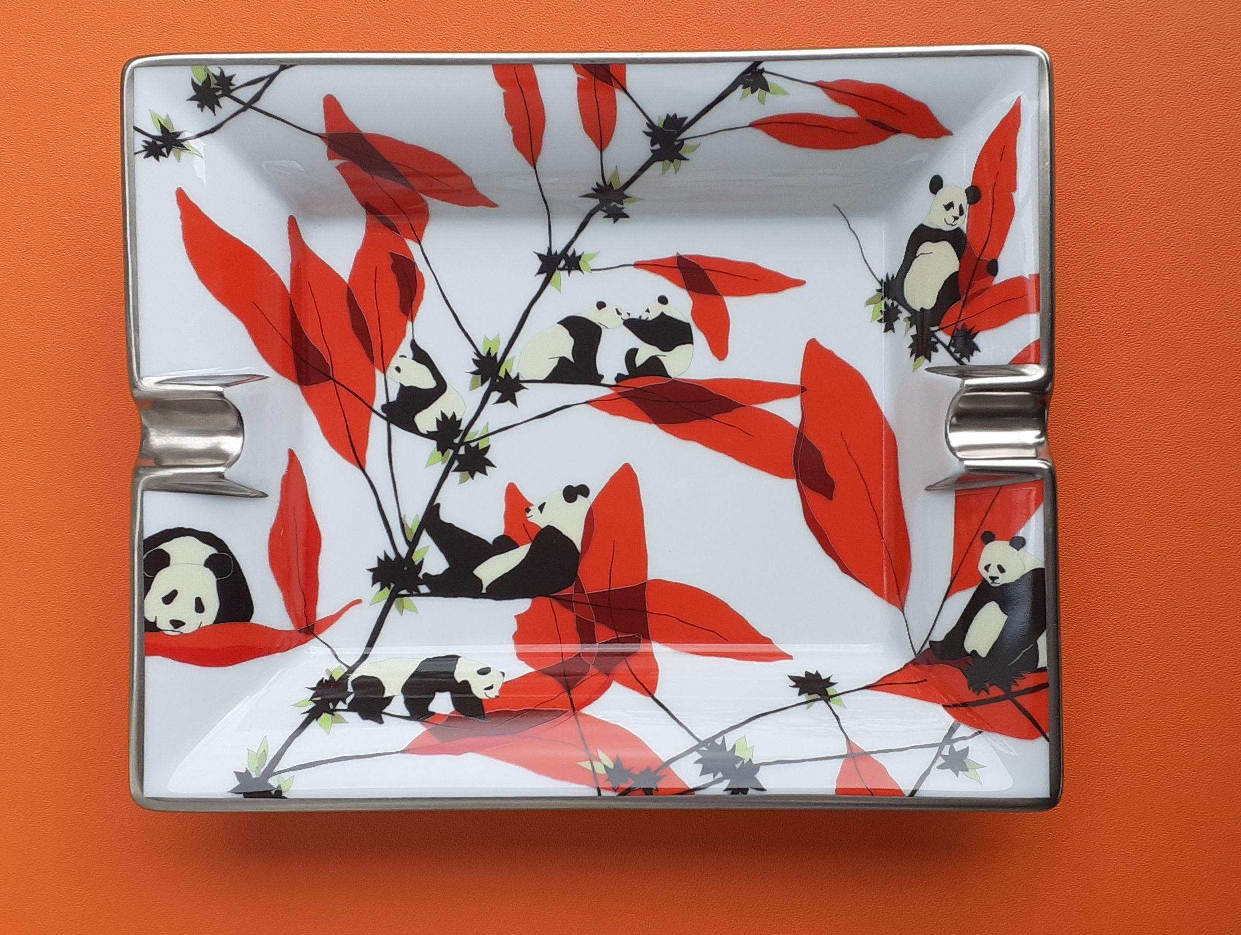 Super Cute Authentic Hermès Ashtray

Pattern: 8 Pandas and Bamboos

Very Rare

Made in France

Made of Porcelain and silver-tone edges

Colorways: White Background, Ivory and Black Pandas, Red and Green Bamboos

Suede Leather at bottom, with 