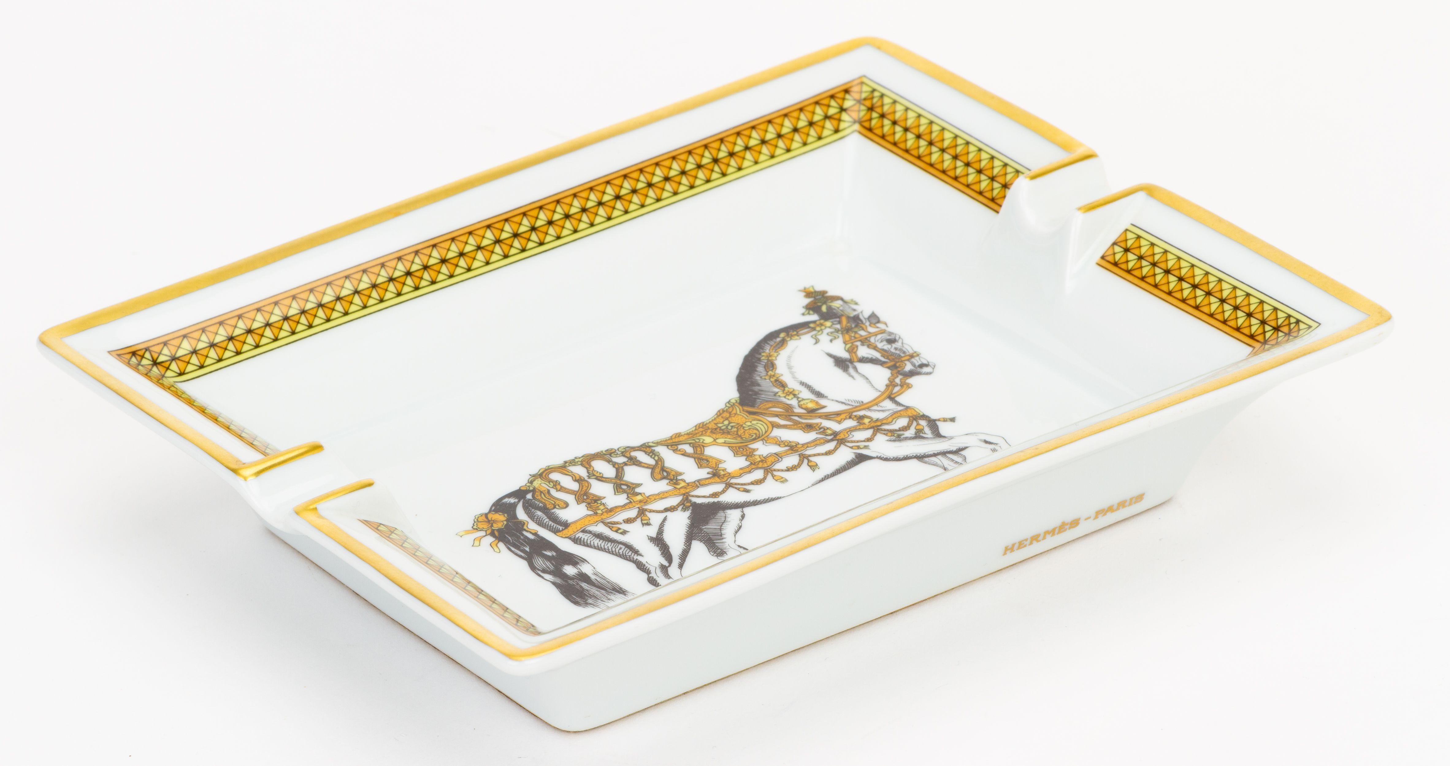 Hermès porcelain ashtray with horse design. Made in France. Comes with original box.