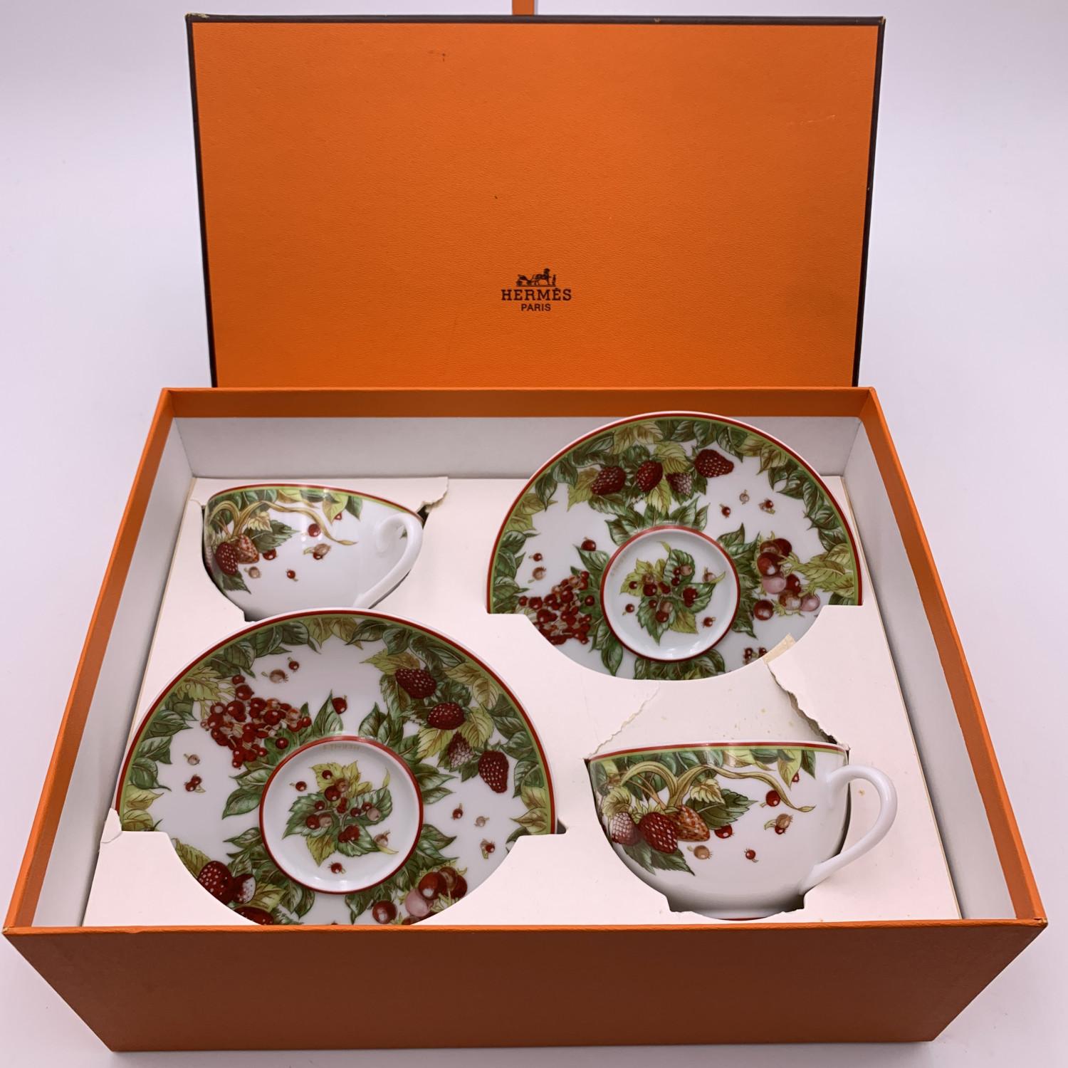 Hermes 'Le Jardin de Pitagore' porcelain set of 2 tea cups cup and saucers. Crafted of fine porcelain. Both are marker 'Hermes paris' on the bottom.
- Cup (HxL): 2.25 x 3.3 inches - 5,6 x 8.6 cm
- Saucer (Diameter): 5.6 inches - 14.4