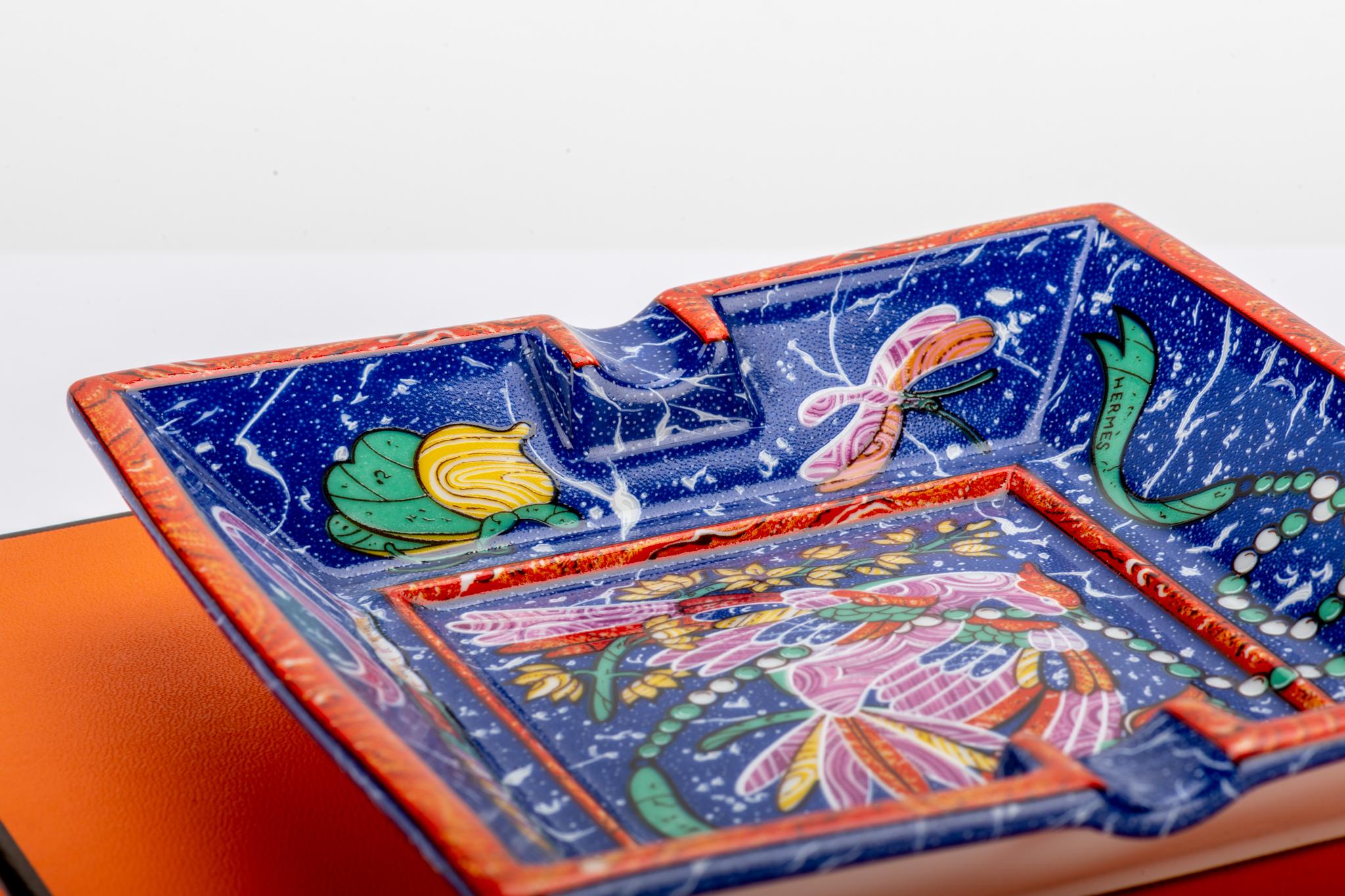 French Hermès square porcelain ashtray with stylized peacock design. Comes with original box.