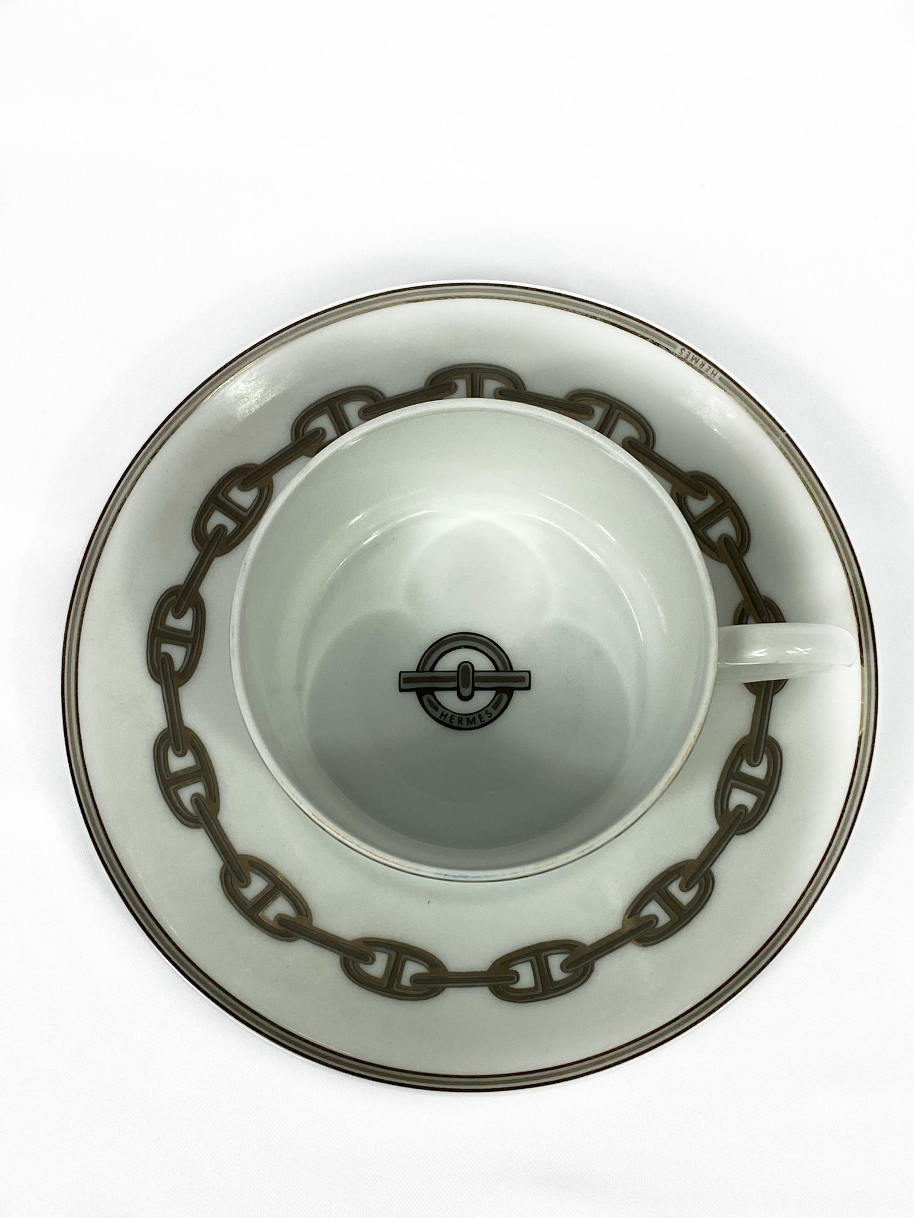HERMES Porcelain Dessert Setting D'Ancre Chaine in Grey Set of 6

Product details:
Set of 6 (total of 18 pieces) :
6 cups, 6 cup plates and 6 dessert plates 
Porcelain
Signed by Hermes (every piece)
Featuring the signature chain link print
The cup
