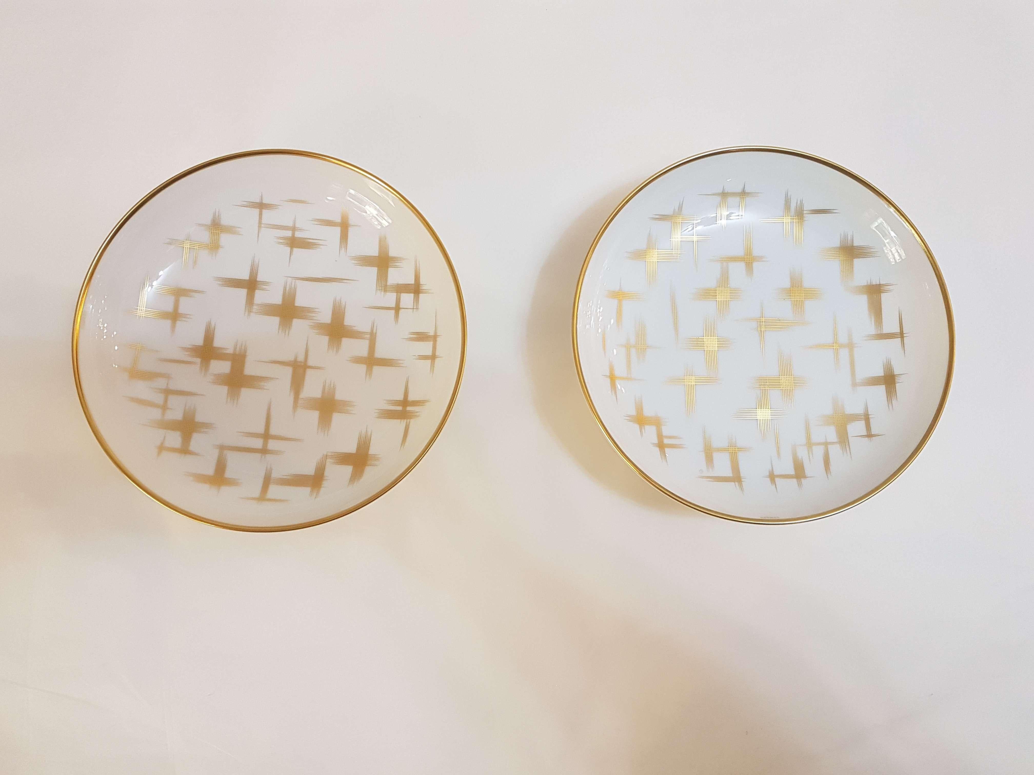 An Hermès porcelain set of two cereal plate, 
