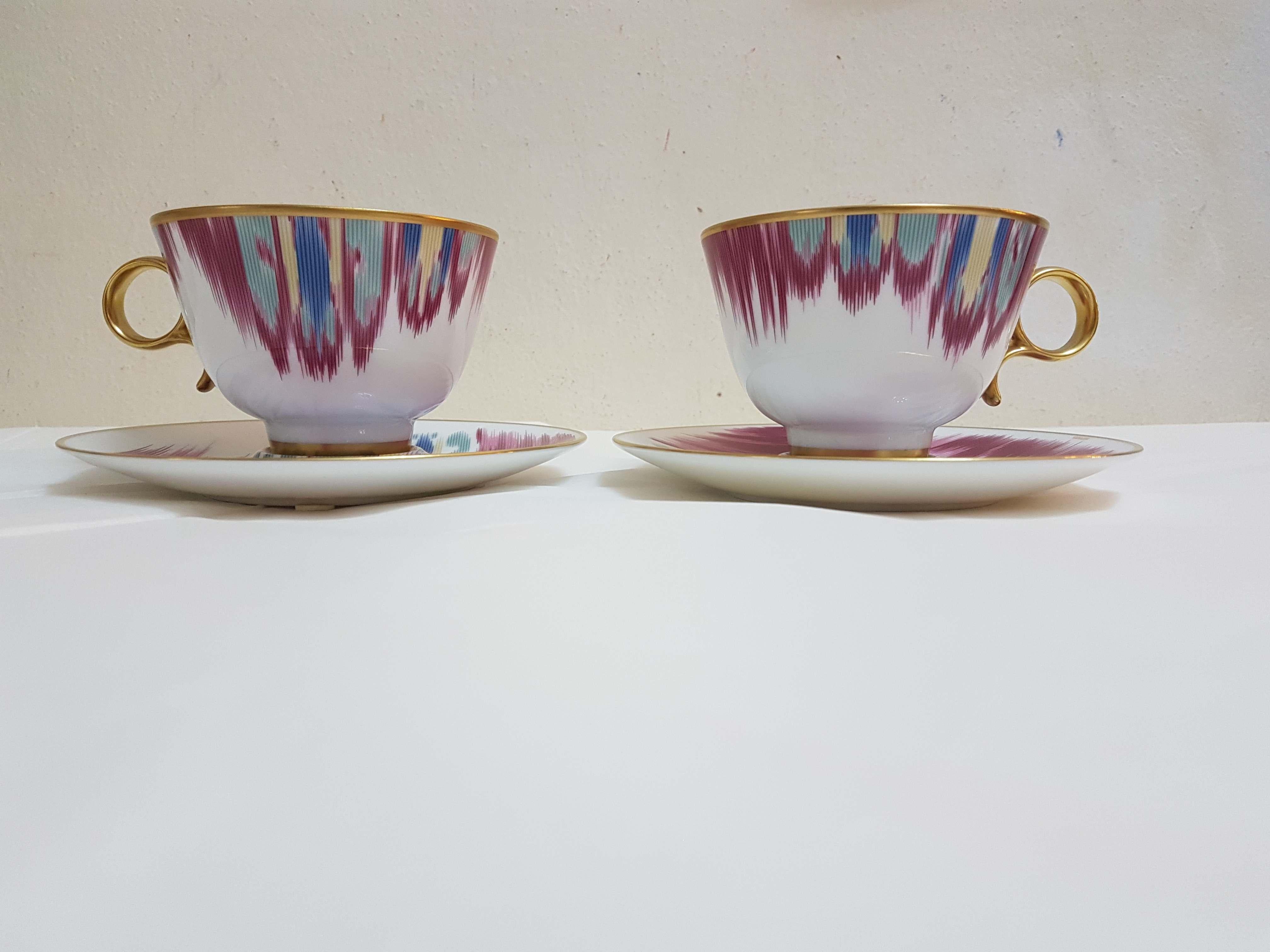 An Hermès porcelain set of two tea cups and saucers, 