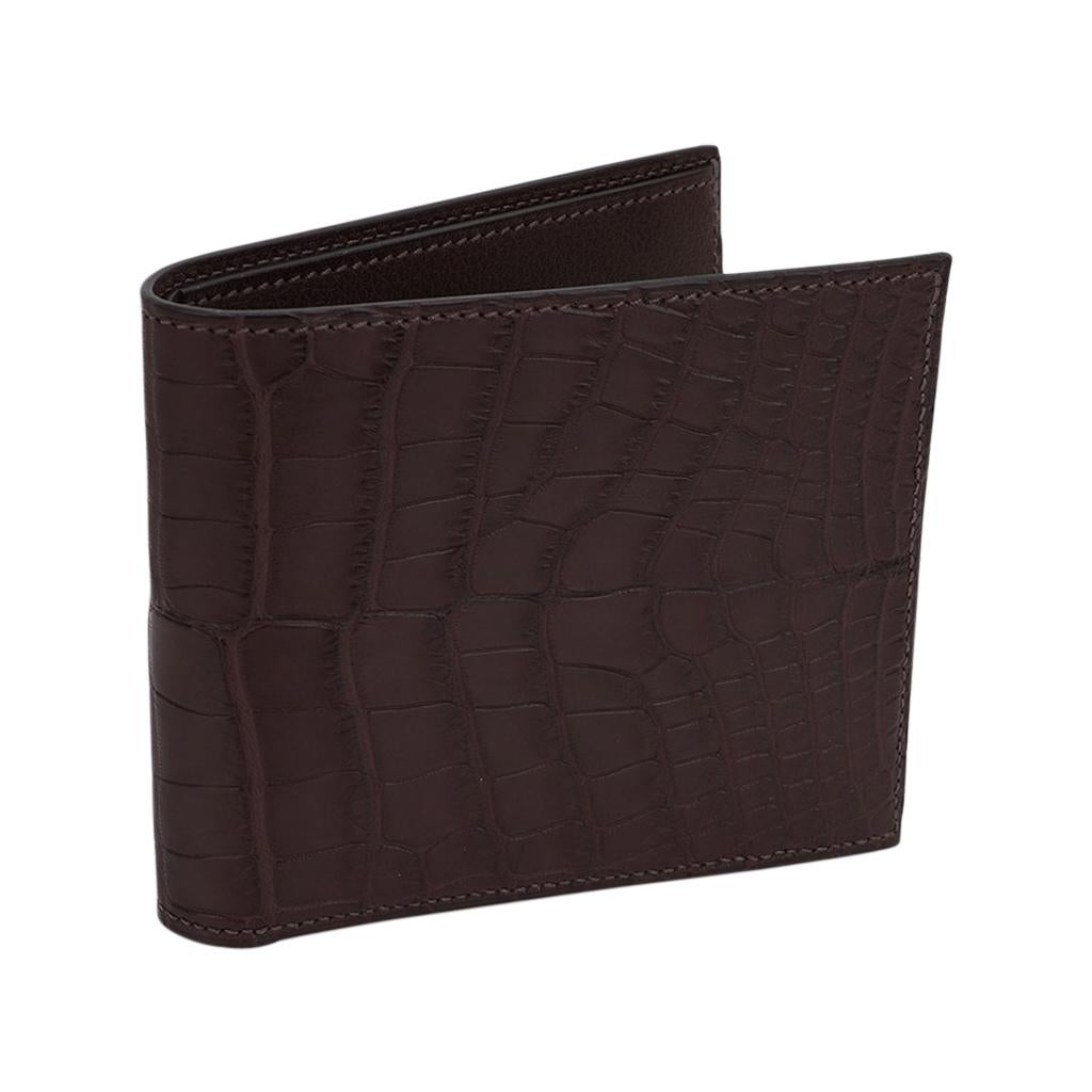 Mightychic offers an Hermes Men's MC2 Copernic compact bi-fold wallet featured in matte Havane Alligator.
This warm tobacco brown men's wallet is rare to find, and is arguably one of the best wallets with clean sleek lines.
Interior is Chevre