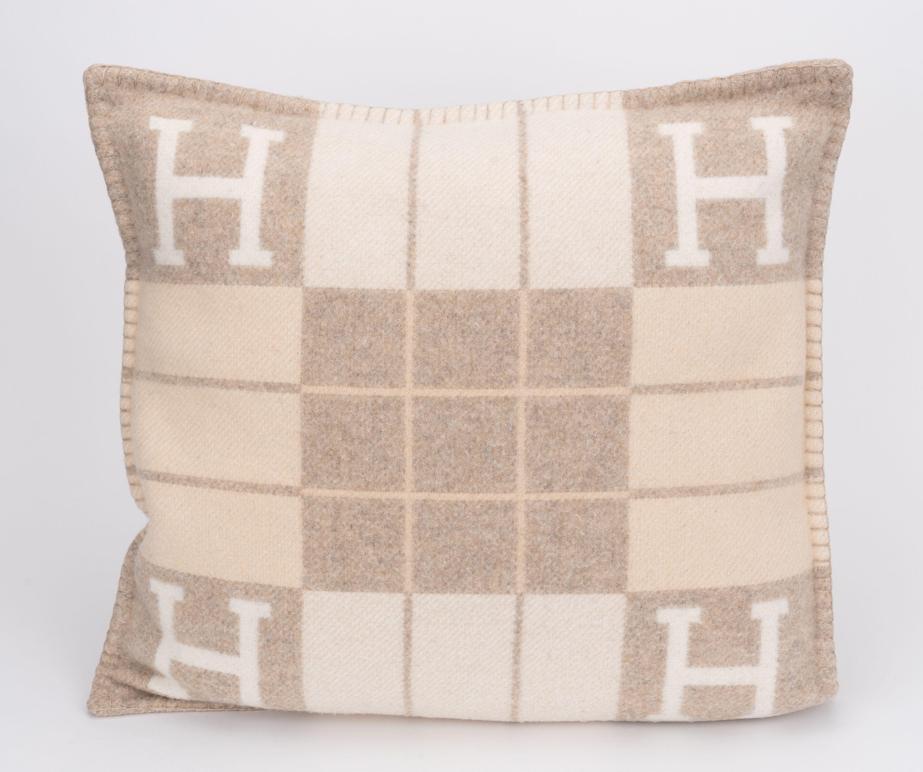 Hermès Avalon III pillow in cream and beige color way. Minimum wear, recently dry cleaned professionally. 2 units available. 90% wool, 10% cashmere.