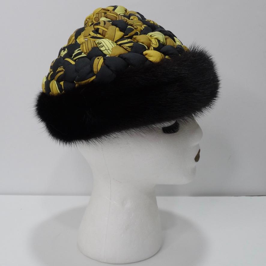 Absolutely sensational Hermes Silk printed hat with a black fur lining. The printed silk is woven to create this gorgeous almost braided effect that is so elegant and regal. The black fur contrasting the silk is the finishing touch and creates such