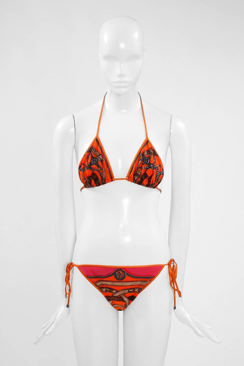 Patterned with an equestrian theme, this Hermes bikini comprises a fully lined triangle top and low-rise briefs. Adjust the ties at hips and neck to create the perfect fit. All ties are finished with rectangular gold metal beads. Made of