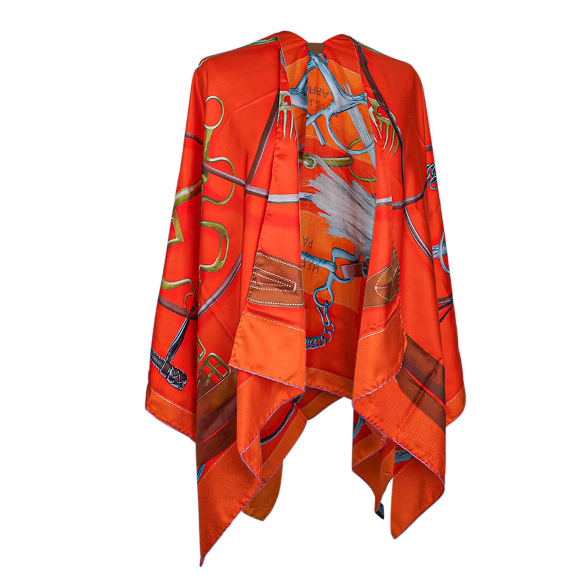 Mightychic offers an Hermes Projets Carres Poncho featured in rich Vermillion and Brun colorway.
The cutout, with lambskin leather tab, transforms this large scarf into a beautiful Poncho.
Depicts an array of elegant accessories for the horse.
Mane