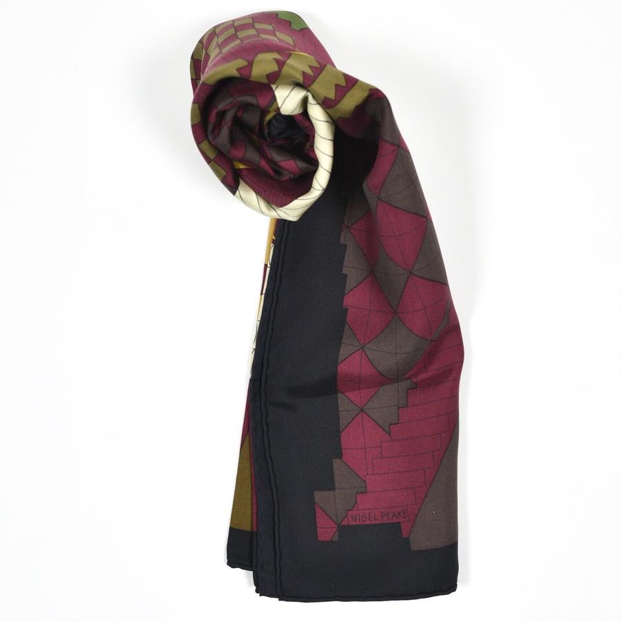 The scarf is from Maison HERMES. It was designed by Nigel Peake in 2013 who titled it 