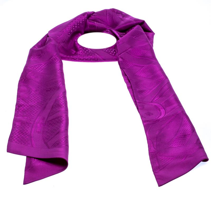 Timeless and elegant, this Hermes Cavalcadour twilly scarf elevates any ordinary outfit in a snap. Made from 100% silk, this purple scarf works as a neck accessory very well. Alternatively, tie it around the handle of your Hermes bag for an