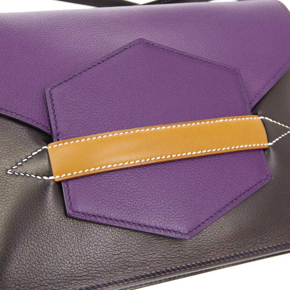 Hermes Purple Cognac Leather  2 in 1 Evening Clutch Shoulder Bag in Box

Leather
Palladium tone hardware
Leather lining
Made in France
Adjustable shoulder strap 15.5-19.25