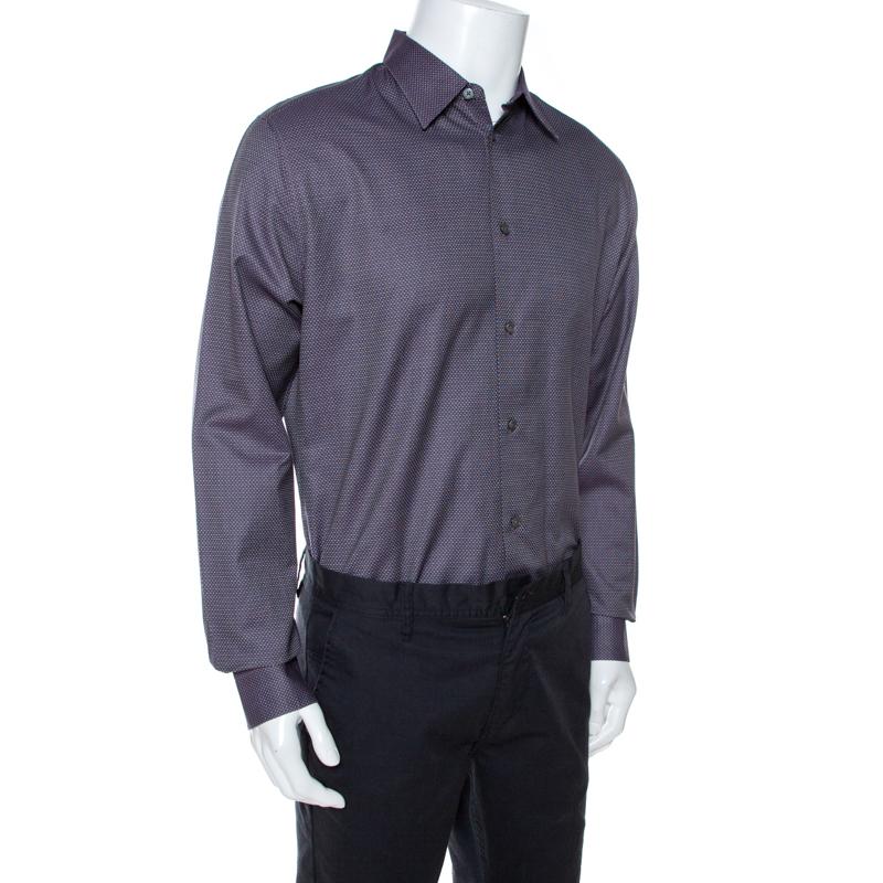 Grab everybody's attention when you walk into a room while donning this stylish shirt fro the iconic house of Hermes. Crafted from 100% cotton, this purple shirt has a lovely jacquard pattern that adds interest. It is styled with a simple collar,