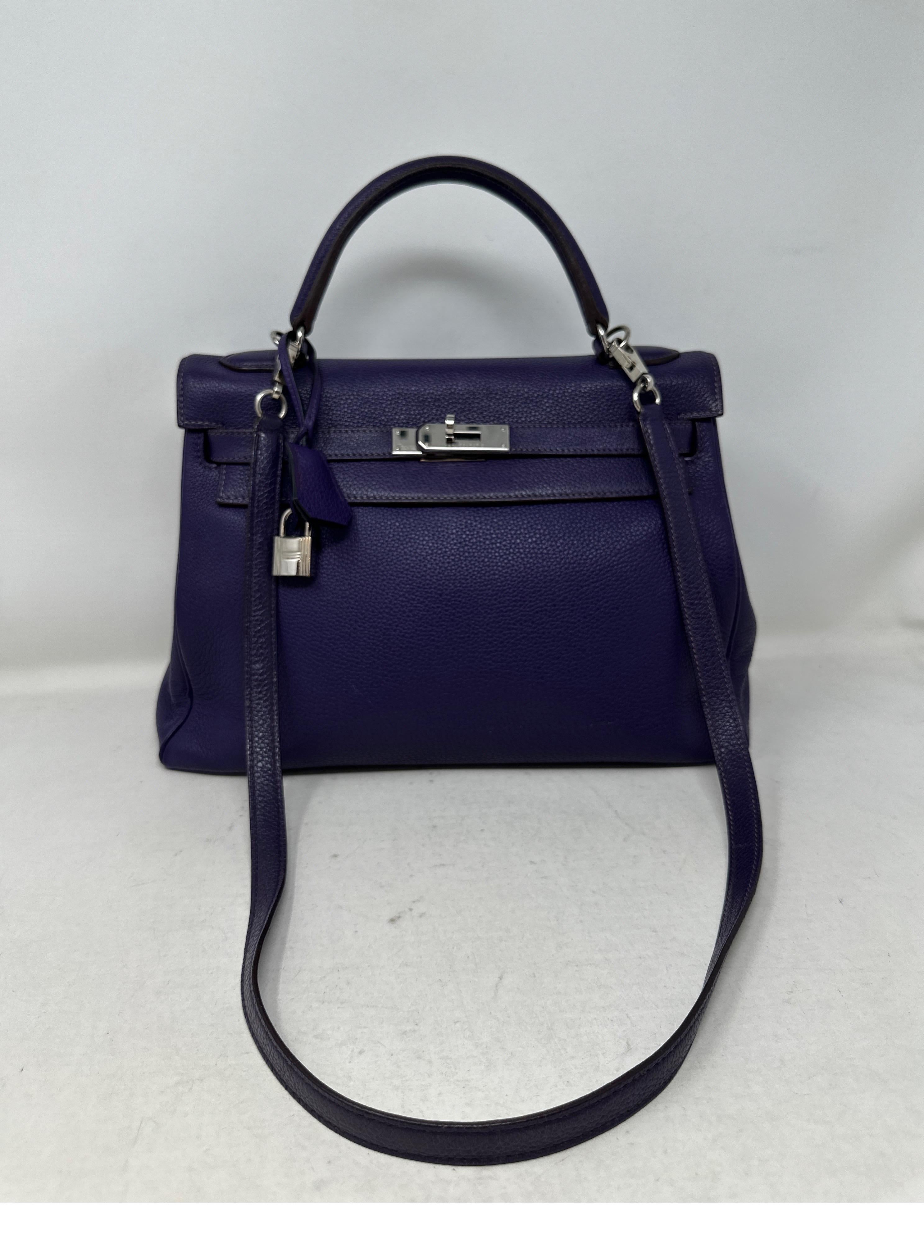Hermes Purple Kelly 32 Bag. Good condition. Light wear throughout. Unique dark purple color. Paladium silver hardware. Interior clean. Plastic is still on hardware. Great deal for a rare color Kelly bag. Includes clochette, lock, keys, and dust bag.