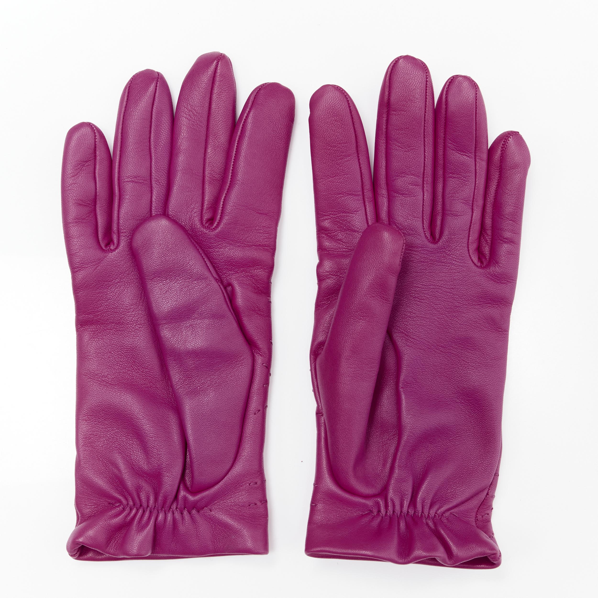 HERMES purple lamb leather overstitching 100% cashmere lined glove 7.5 
Reference: MELK/A00164 
Brand: Hermes 
Material: Leather 
Color: Purple 
Pattern: Solid 
Extra Detail: Elasticated stretch cuff 
Made in: France 

CONDITION: 
Condition: