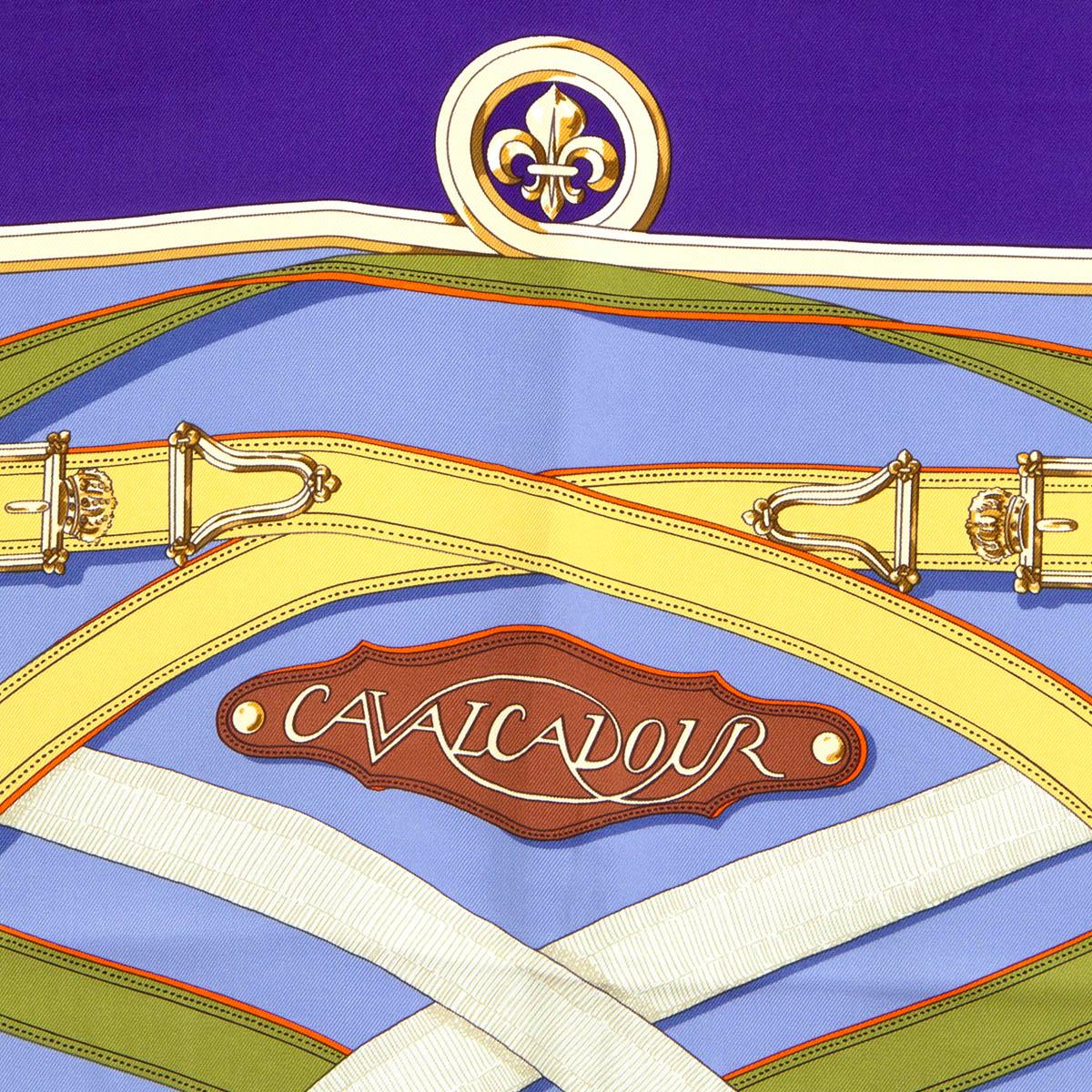 100% authentic Hermès 'Cavalcadour 90' scarf by Henri d'Origny in sky blue silk twill (100%) with purple border anda details in yellow, white, green, pink and brown. Has been worn and is in excellent condition.

Issued in 2011

Story